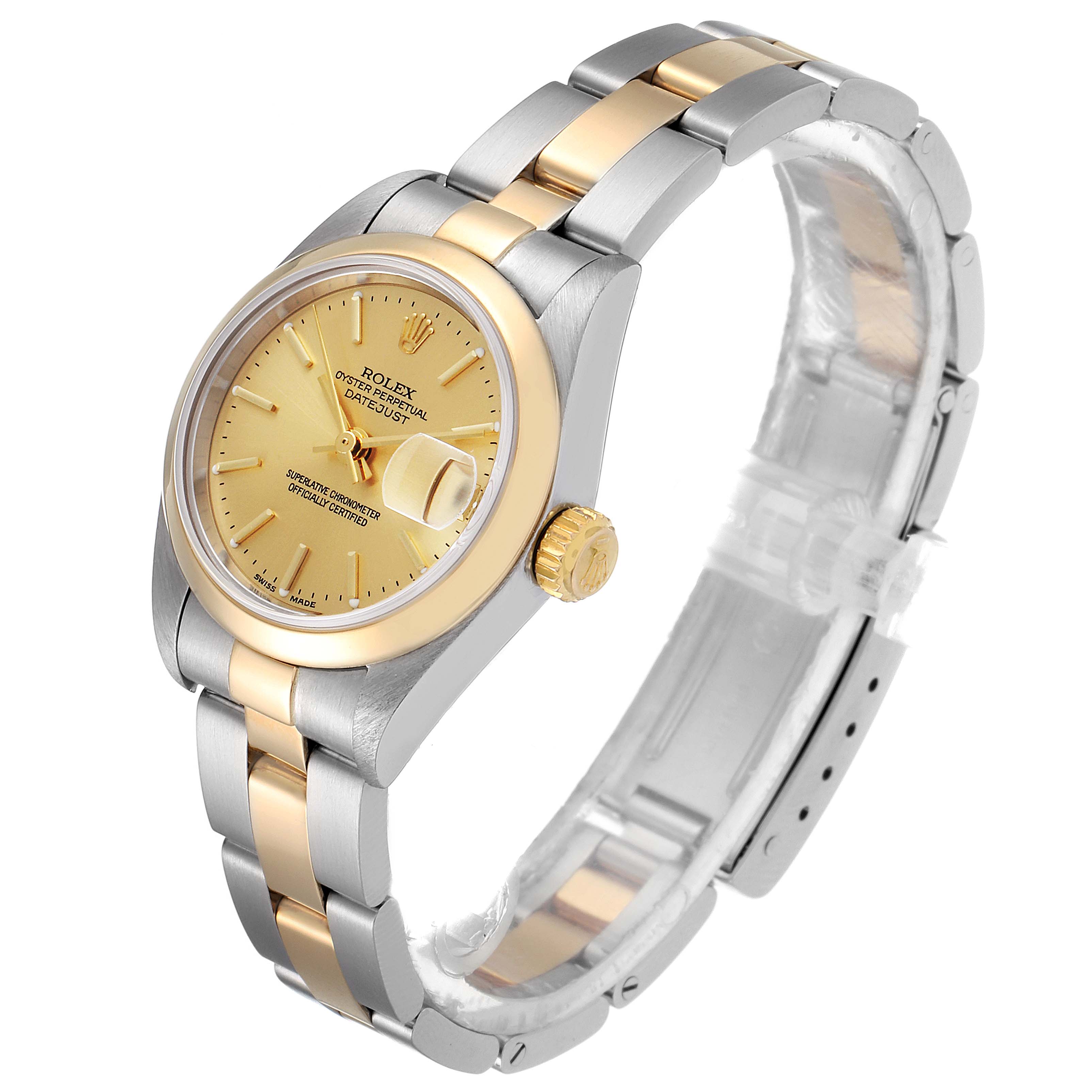 This image shows a side angle of a Rolex Datejust 79163 Women's Steel and Gold (two tone) Champagne Dial 79163 Women's Steel and Gold (two tone) Champagne Dial watch, featuring its gold and silver bracelet, crown, and face.