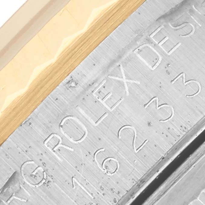 The image shows a close-up of the model number engraved on the case of a Rolex Datejust 16233 Men
s Stainless Steel White Dial 16233 Men
s Stainless Steel White Dial watch.
