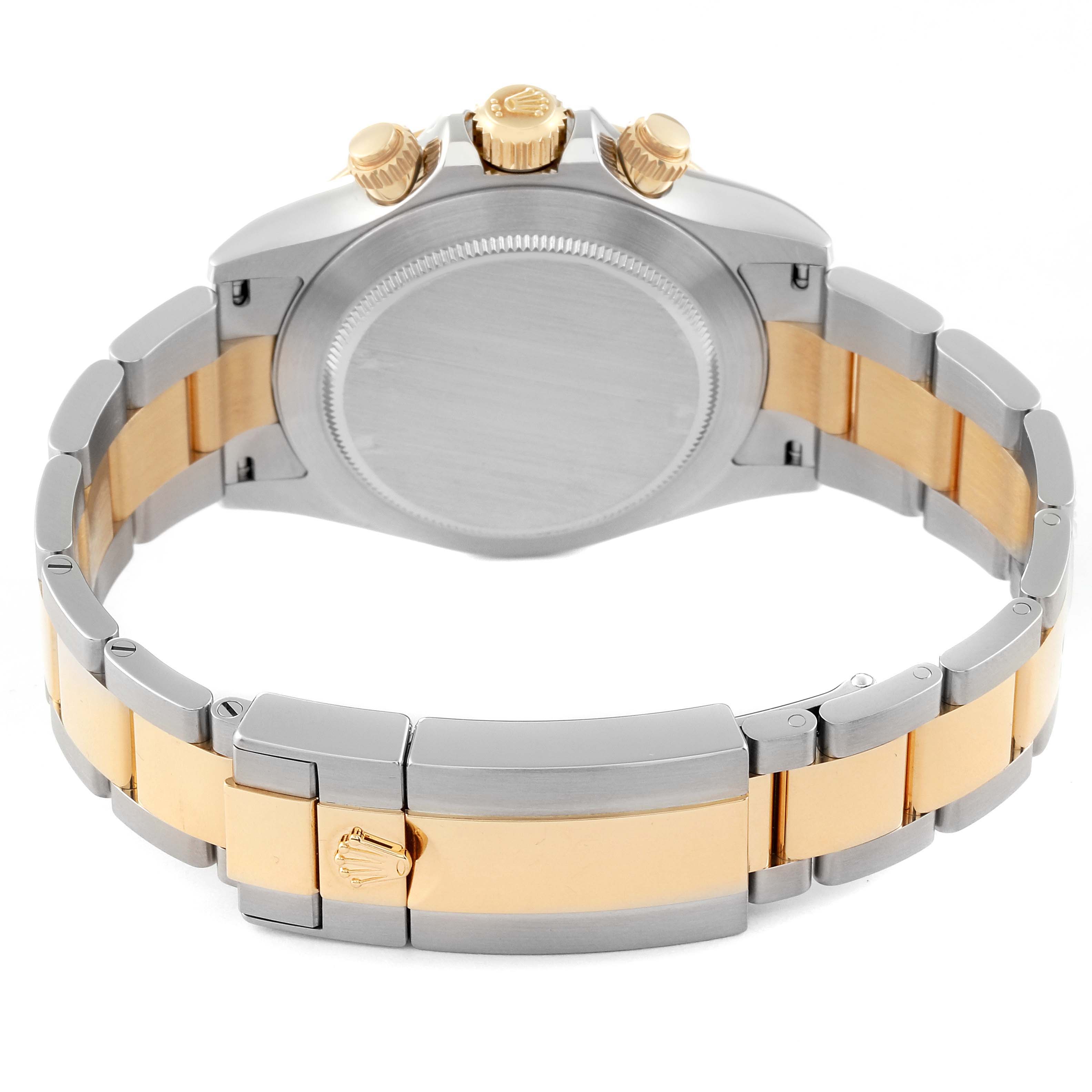 The image shows the back of a Rolex Daytona 116523 Men's Steel and Gold (two tone) Black Dial 116523 Men's Steel and Gold (two tone) Black Dial watch, focusing on the case back, crown, pushers, and two-tone bracelet.