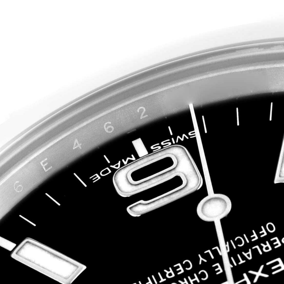 The image shows a close-up of the dial on a Rolex Explorer 214270 Men's Stainless Steel Black Dial 214270 Men's Stainless Steel Black Dial, highlighting the number "9" and the text "SWISS MADE."