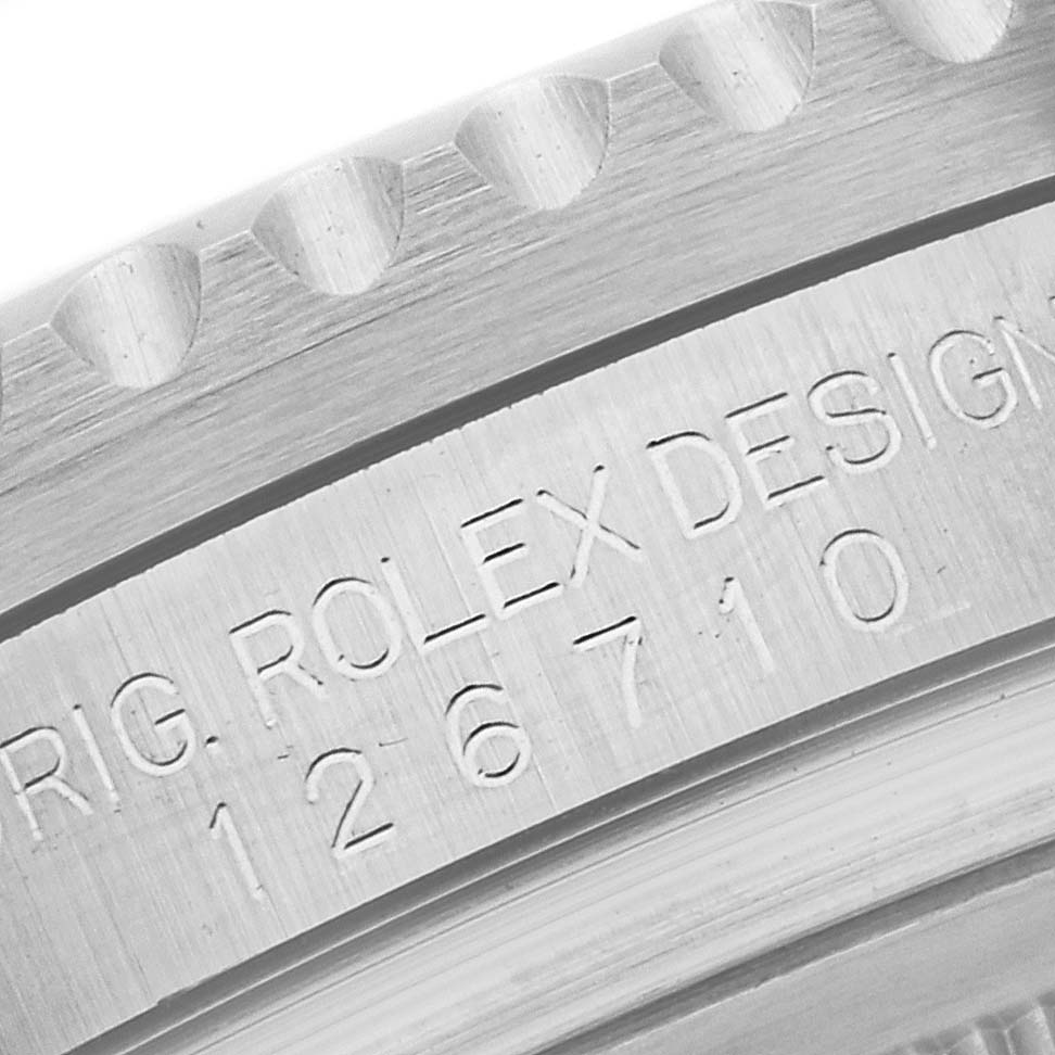 This close-up image shows the engraved model number and design identification on the case of a Rolex GMT-Master 126710BLNR Men
s Stainless Steel Black Dial 126710BLNR Men
s Stainless Steel Black Dial watch.