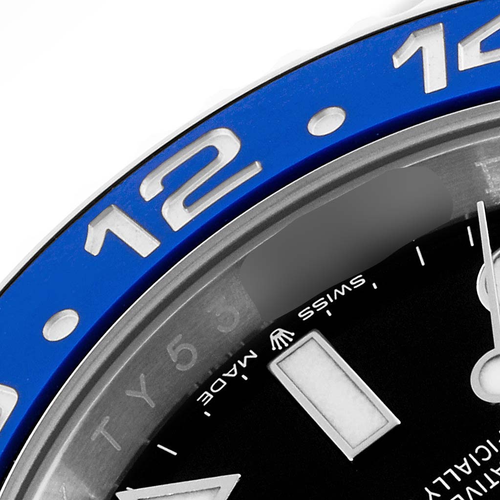 The image shows a close-up of the bezel, dial, and part of the hands of a Rolex GMT-Master 126710BLNR Men
s Stainless Steel Black Dial 126710BLNR Men
s Stainless Steel Black Dial watch.