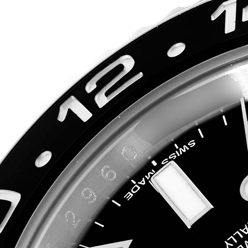 This close-up shows the bezel and part of the dial of the Rolex GMT-Master 116710LN Men
s Stainless Steel Black Dial 116710LN Men
s Stainless Steel Black Dial watch.