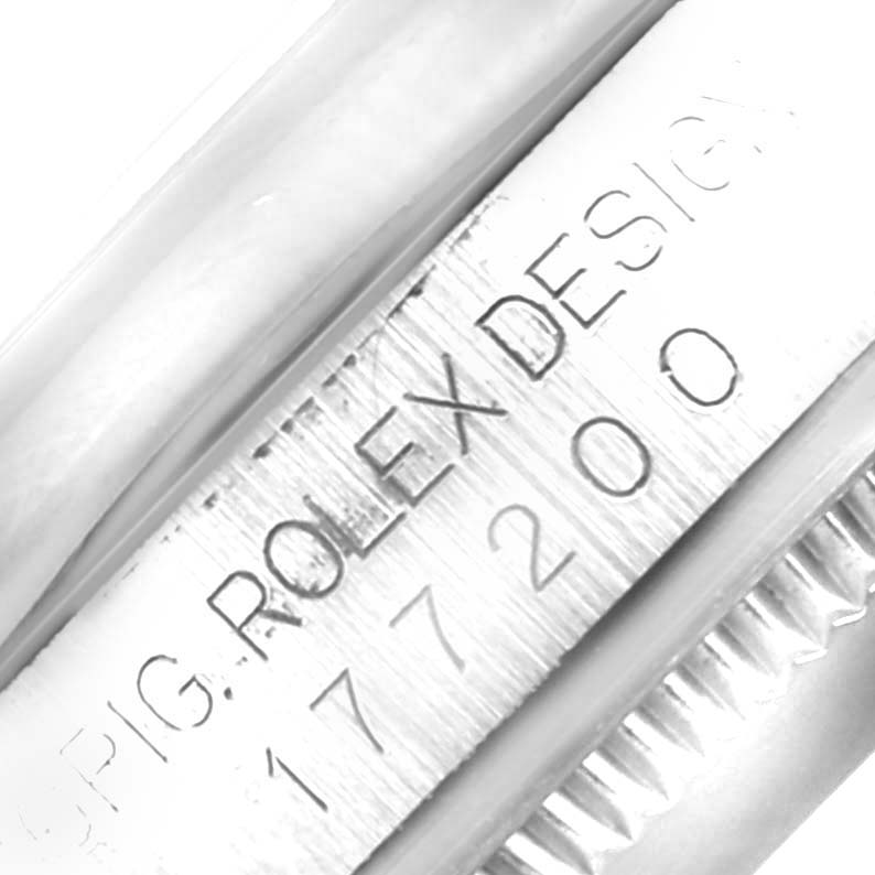 This close-up image shows the model and serial numbers engraved on the side of the watch case of a Rolex Mid-Size 177200 Women
s Stainless Steel Blue Dial 177200 Women
s Stainless Steel Blue Dial model.