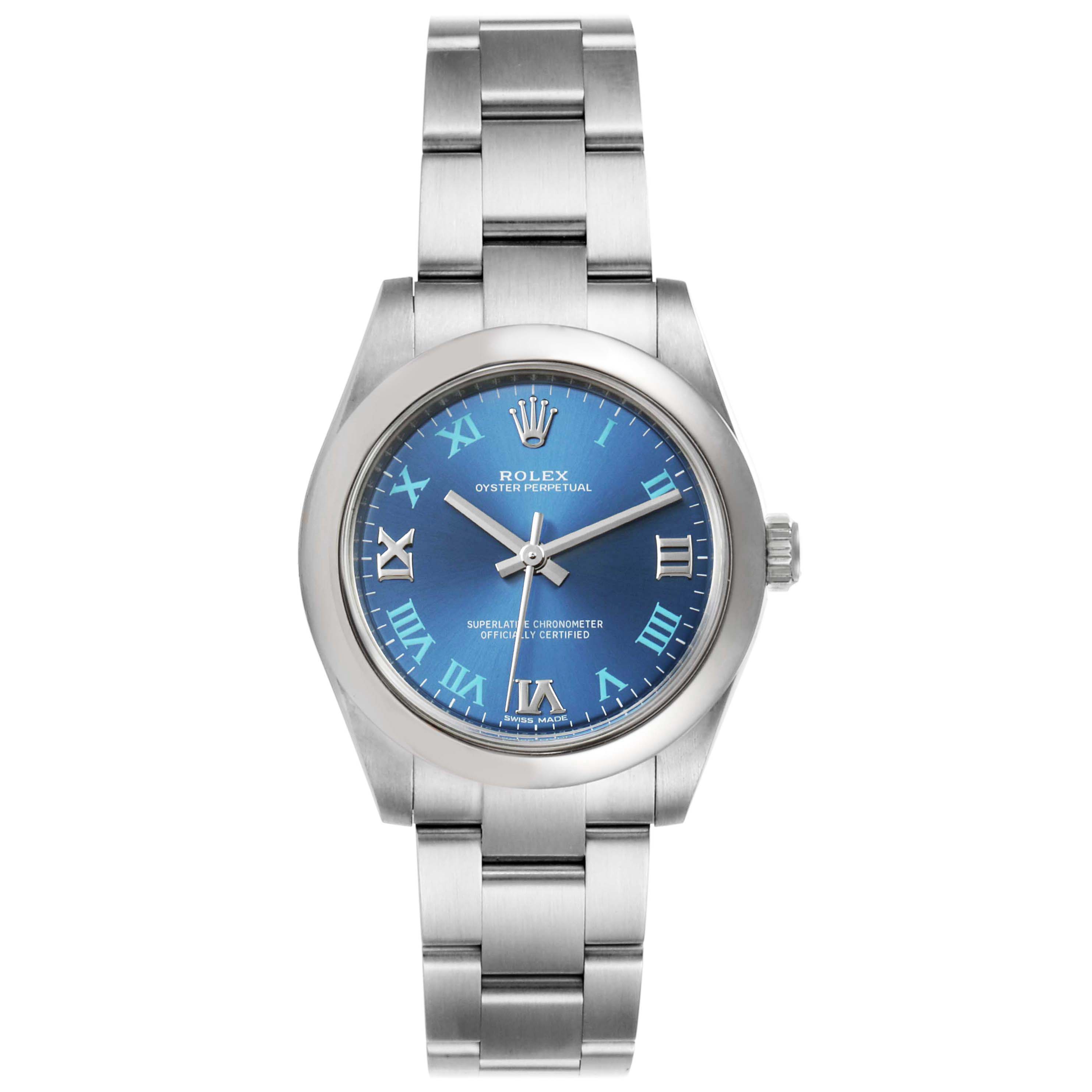 The image shows a front view of a Rolex Oyster Perpetual Mid-Size watch featuring a blue dial and stainless steel bracelet.