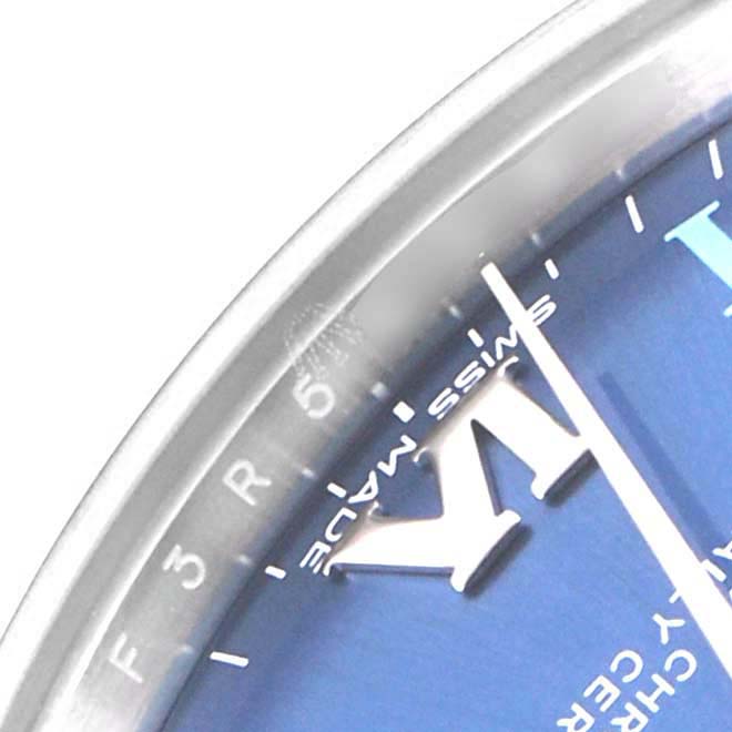 This image shows a close-up of the dial and bezel of the Mid-Size Rolex watch, highlighting the Roman numeral markers and minute indices.