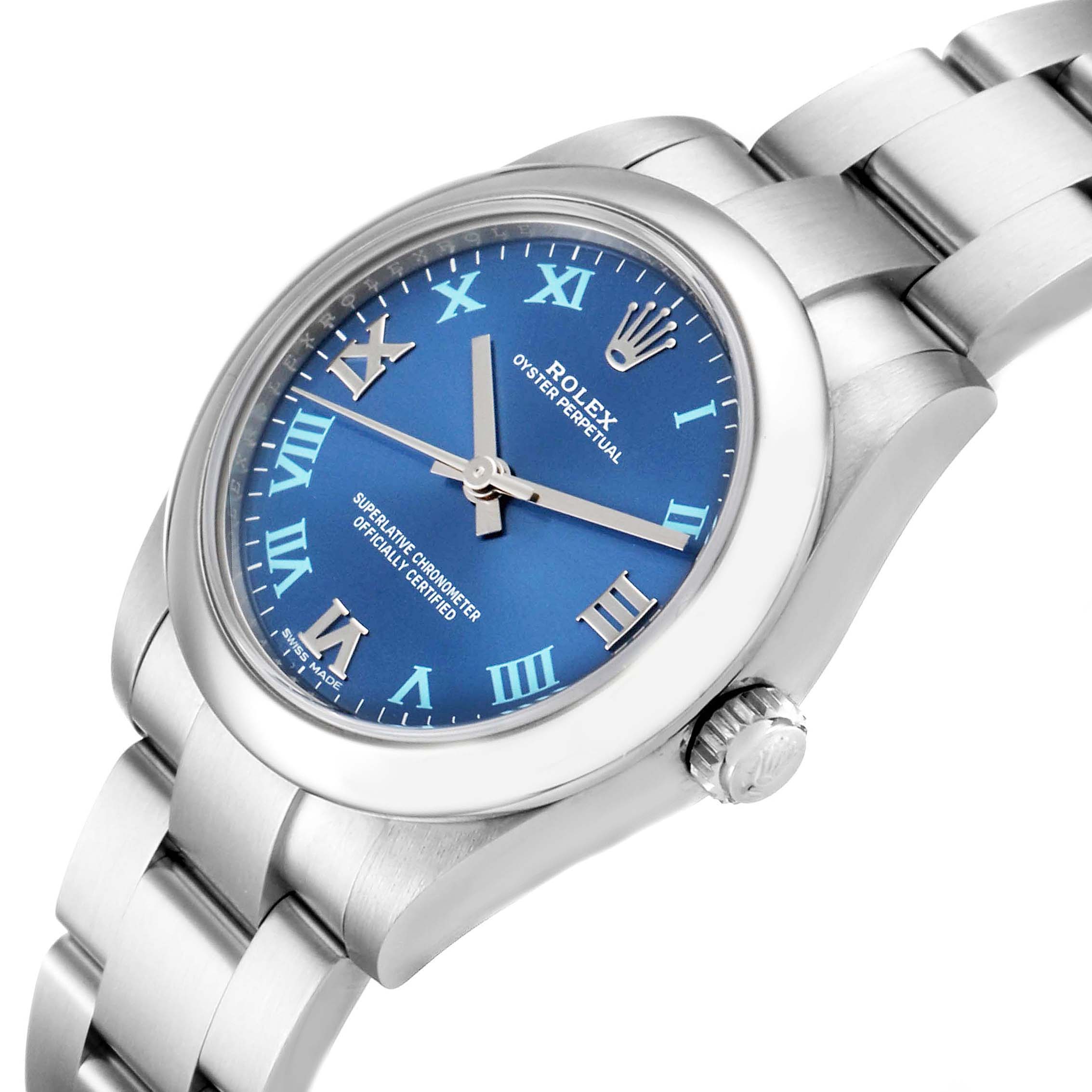 The Rolex Mid-Size 177200 Women
s Stainless Steel Blue Dial 177200 Women
s Stainless Steel Blue Dial Oyster Perpetual watch is shown at an angle highlighting the dial, bezel, crown, and part of the bracelet.
