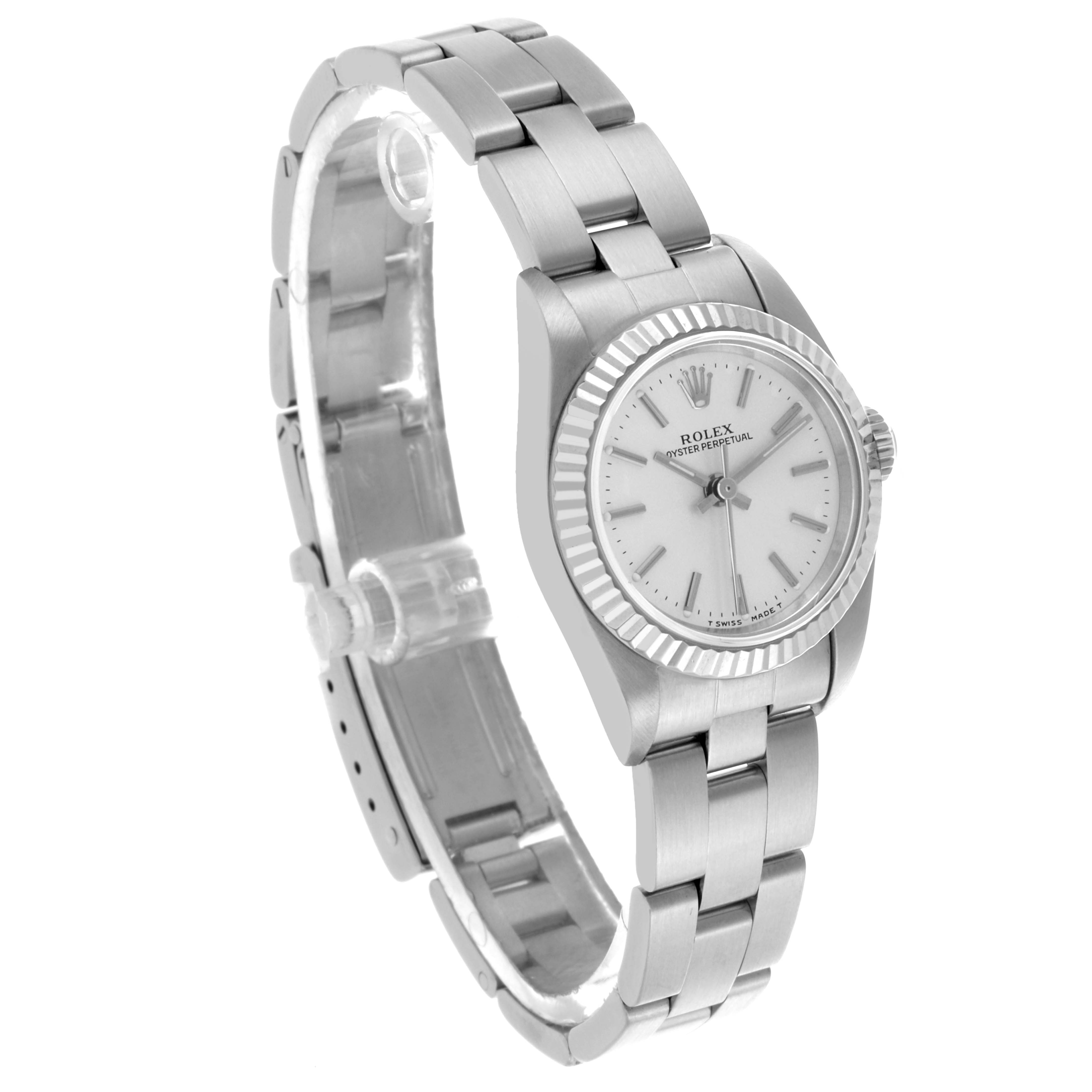 The Rolex Oyster Perpetual 67194 Women's Stainless Steel Silver Dial 67194 Women's Stainless Steel Silver Dial watch is shown from an oblique angle, highlighting its face, bezel, and bracelet.