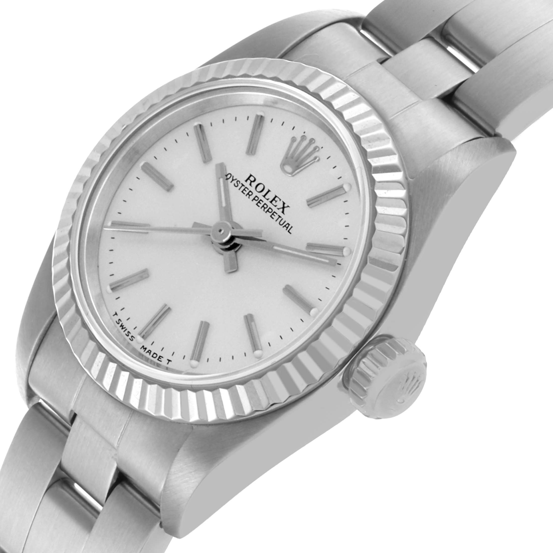The Rolex Oyster Perpetual 67194 Women's Stainless Steel Silver Dial 67194 Women's Stainless Steel Silver Dial watch is shown from a top-side angle, displaying the dial, bezel, case, crown, and part of the bracelet.