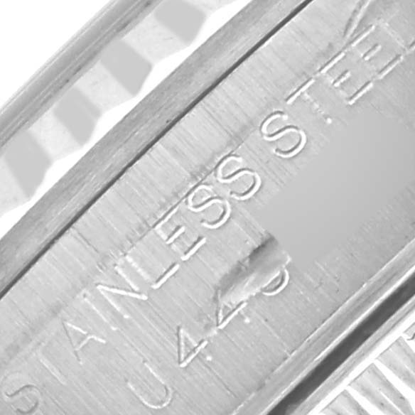 The image shows a close-up of the inner band of a Rolex Oyster Perpetual 67194 Women's Stainless Steel Silver Dial 67194 Women's Stainless Steel Silver Dial watch, highlighting the "STAINLESS STEEL" engraving.