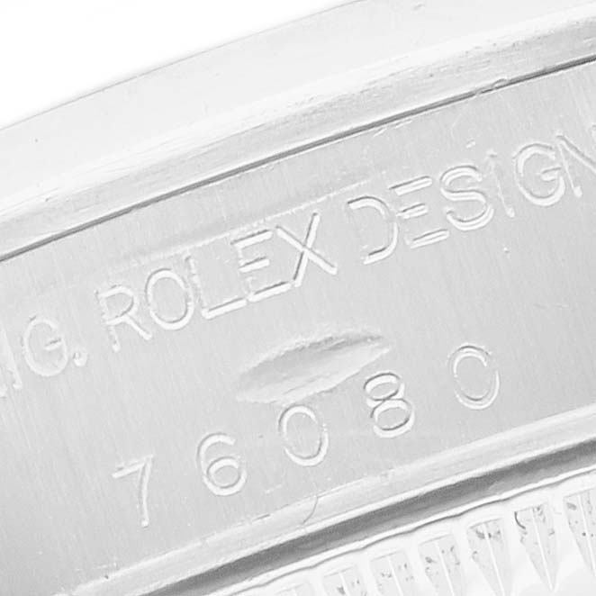 The image shows the engraved side of the Rolex Oyster Perpetual 24 Women's Stainless Steel White Dial 24 Women's Stainless Steel White Dial watch, focusing on the model number.