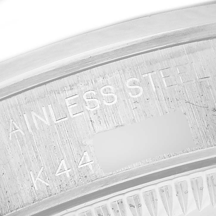 The image shows a close-up of the steel case back with markings of the Rolex Oyster Perpetual 24 Women's Stainless Steel White Dial 24 Women's Stainless Steel White Dial watch.