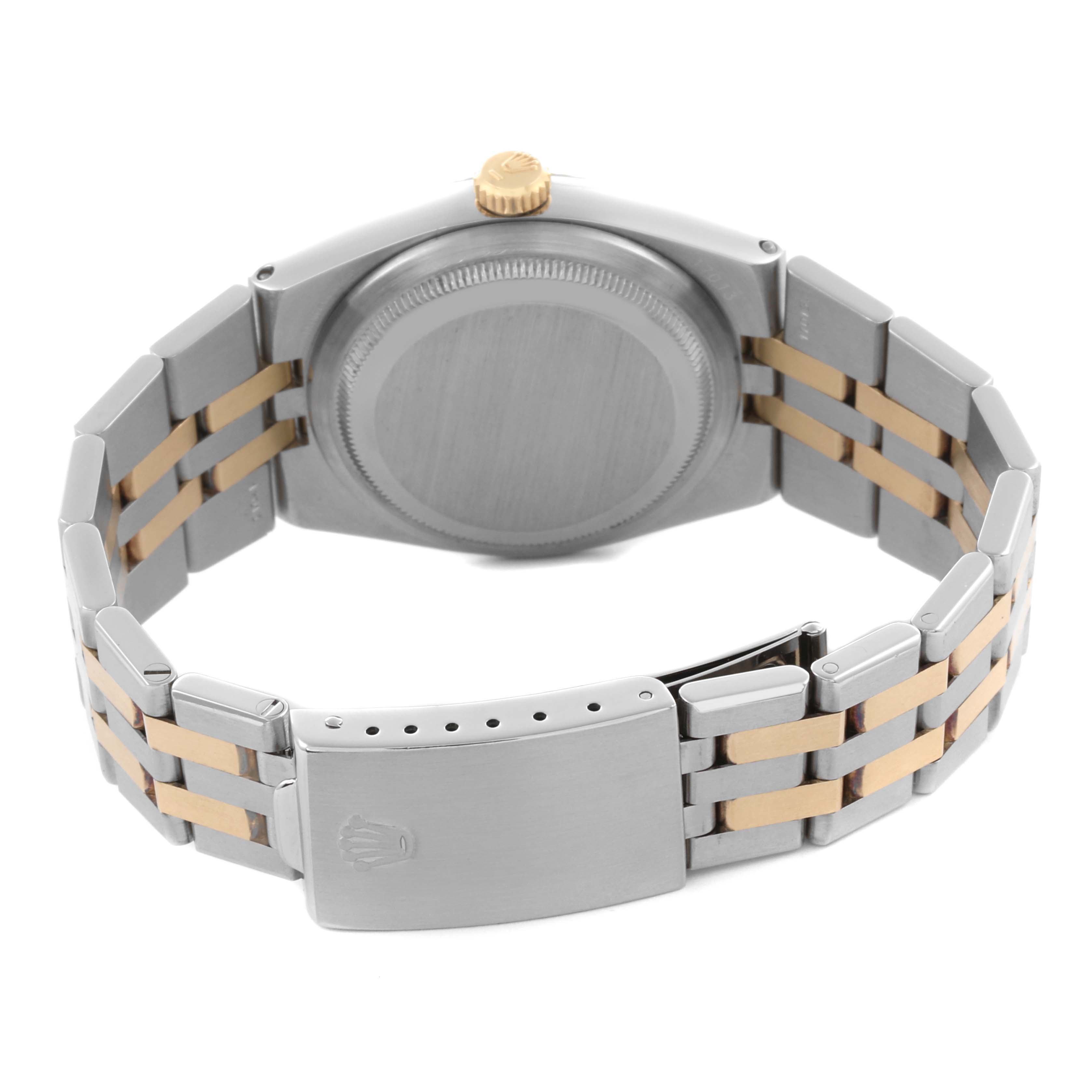 The Rolex Oysterquartz 17013 Men's Steel and Gold (two tone) Champagne Dial 17013 Men's Steel and Gold (two tone) Champagne Dial watch is shown from the back, highlighting the case, bracelet, and clasp.