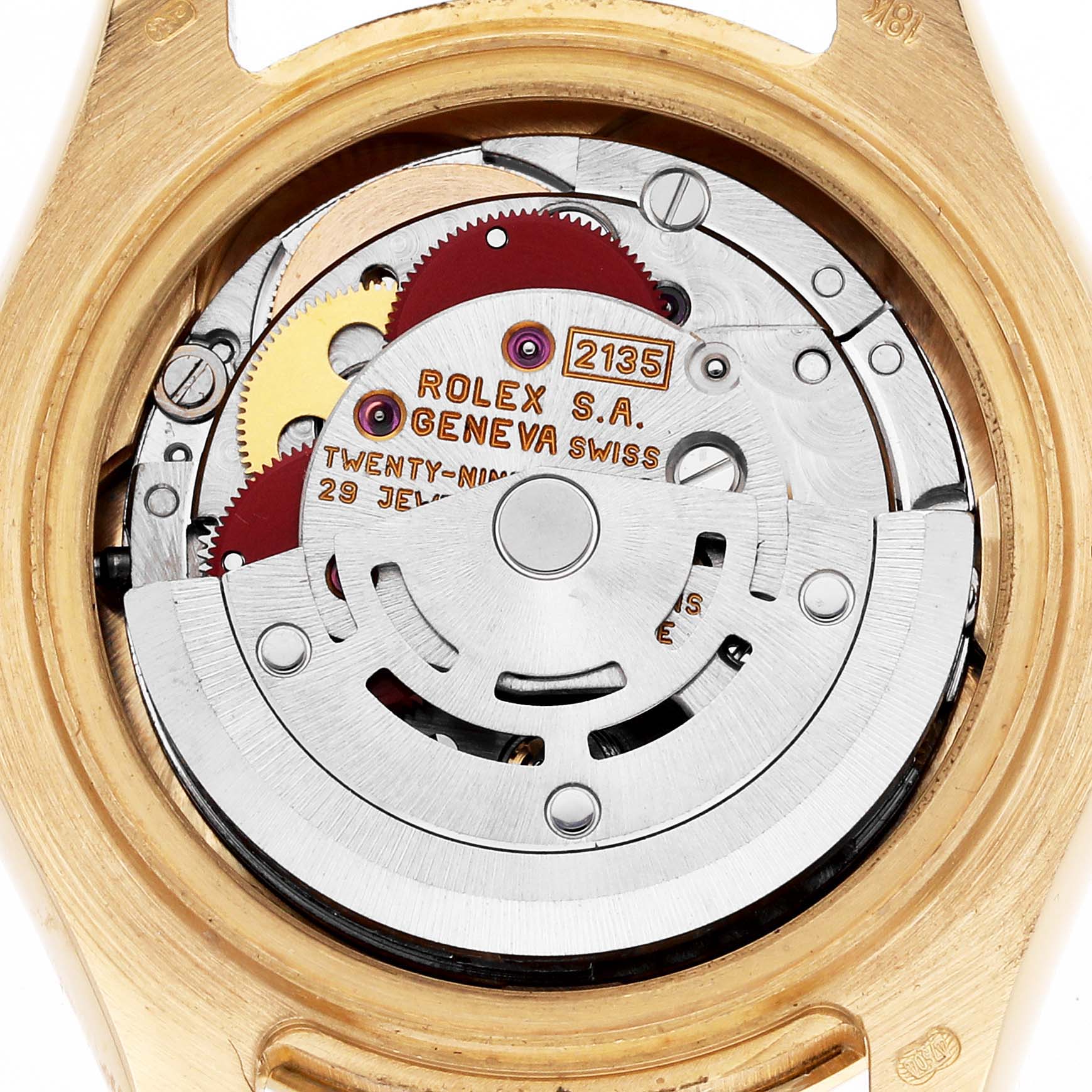 The image shows the internal movement of a Rolex Pearlmaster 69298 Women
s Yellow Gold Champagne Dial 69298 Women
s Yellow Gold Champagne Dial watch, showcasing gears and inscriptions.