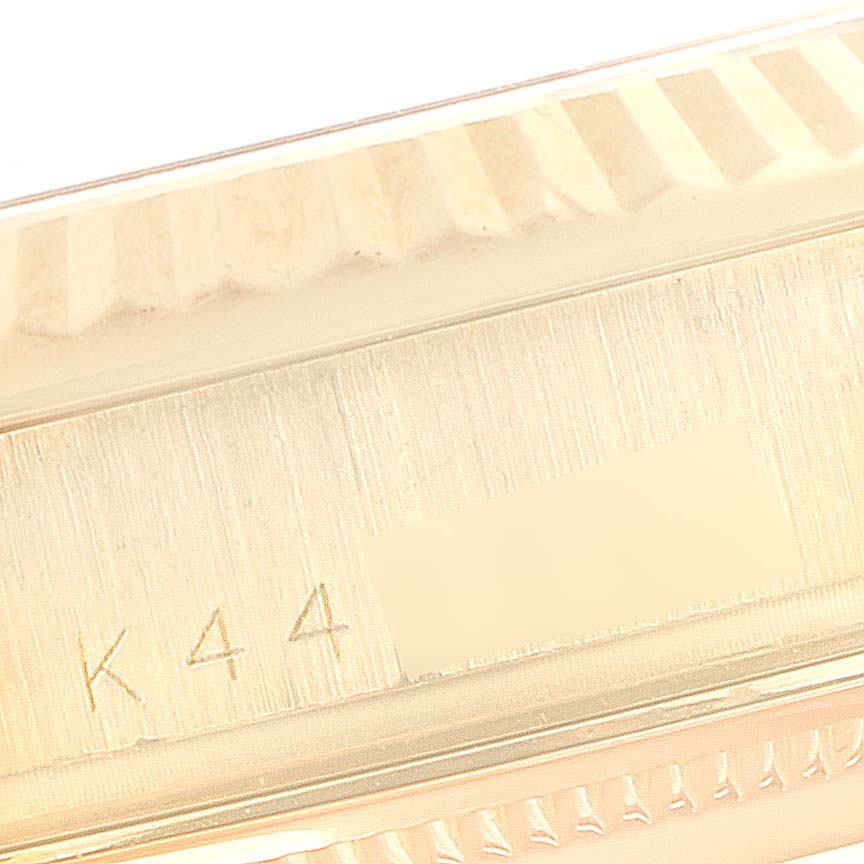 This image shows a close-up of the case side with branding and engraving details of a Rolex President 118238 Men's Yellow Gold Mother of Pearl Dial 118238 Men's Yellow Gold Mother of Pearl Dial model watch.