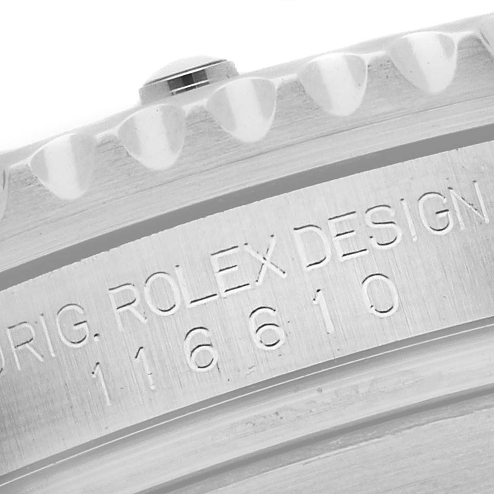 This image shows a close-up of the case and engraved inner bezel of the Rolex Submariner 116610LV Men's Stainless Steel Green Dial 116610LV Men's Stainless Steel Green Dial model 116610.