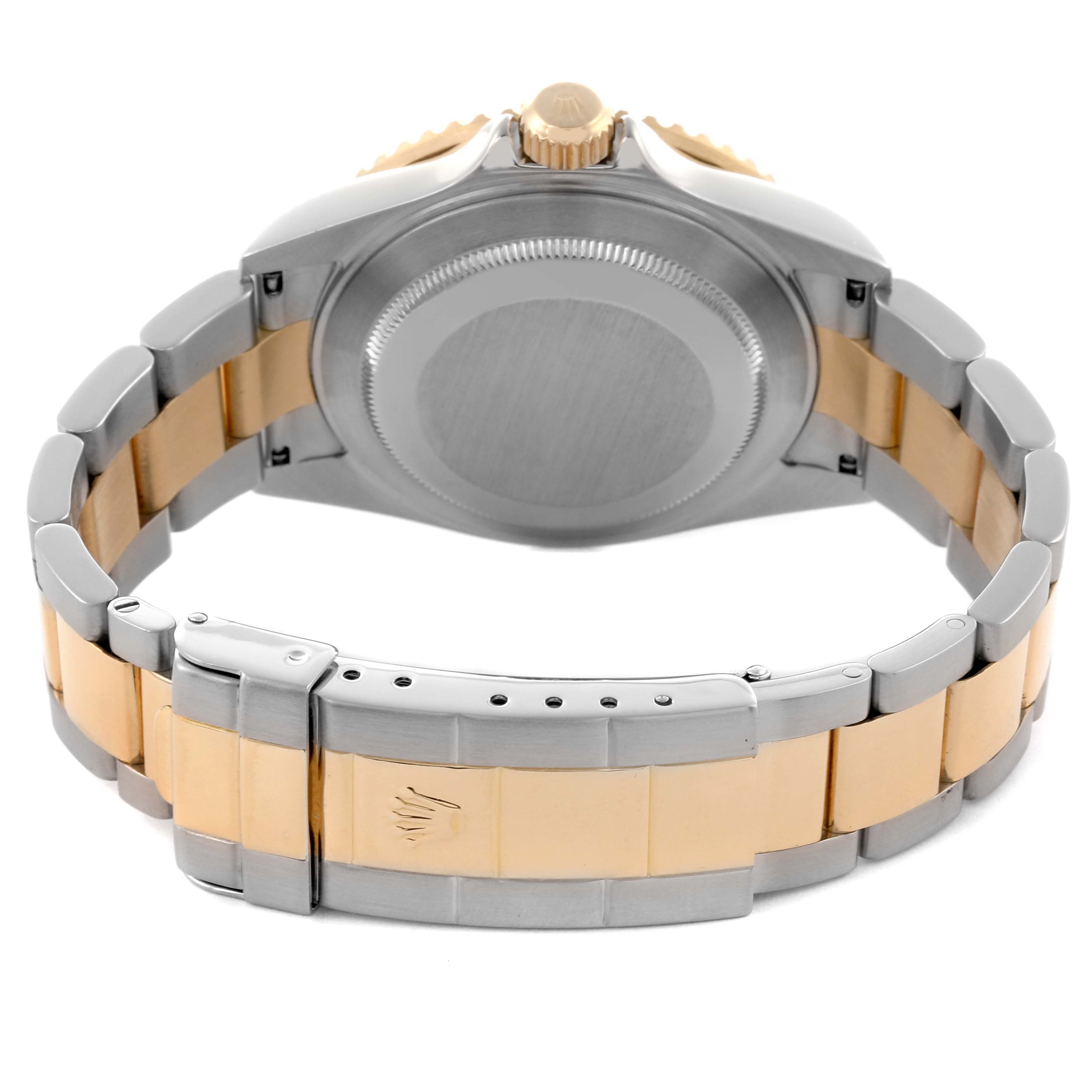 The image shows the back of a Rolex Submariner 16613 Men's Steel and Gold (two tone) Grey Dial 16613 Men's Steel and Gold (two tone) Grey Dial watch, highlighting the case back, crown, and two-tone bracelet with clasp.