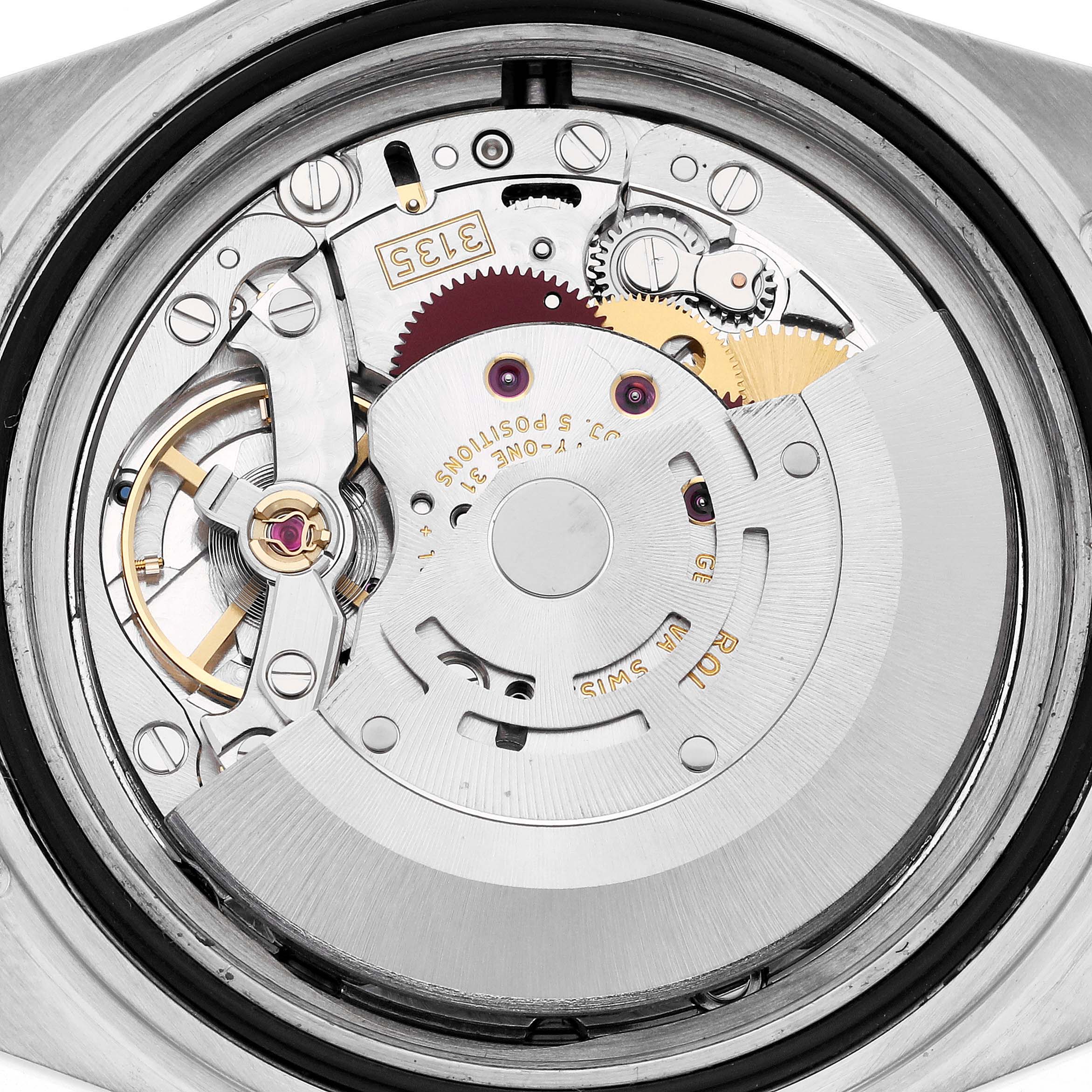 The image shows a close-up of the movement inside a Rolex Submariner 16613 Men's Steel and Gold (two tone) Grey Dial 16613 Men's Steel and Gold (two tone) Grey Dial, highlighting gears and mechanical components.