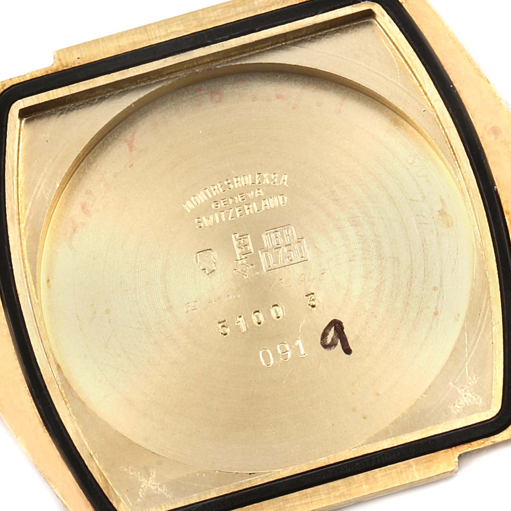The image shows the interior of the case back of a Vintage Collection Rolex watch, highlighting its markings and material.