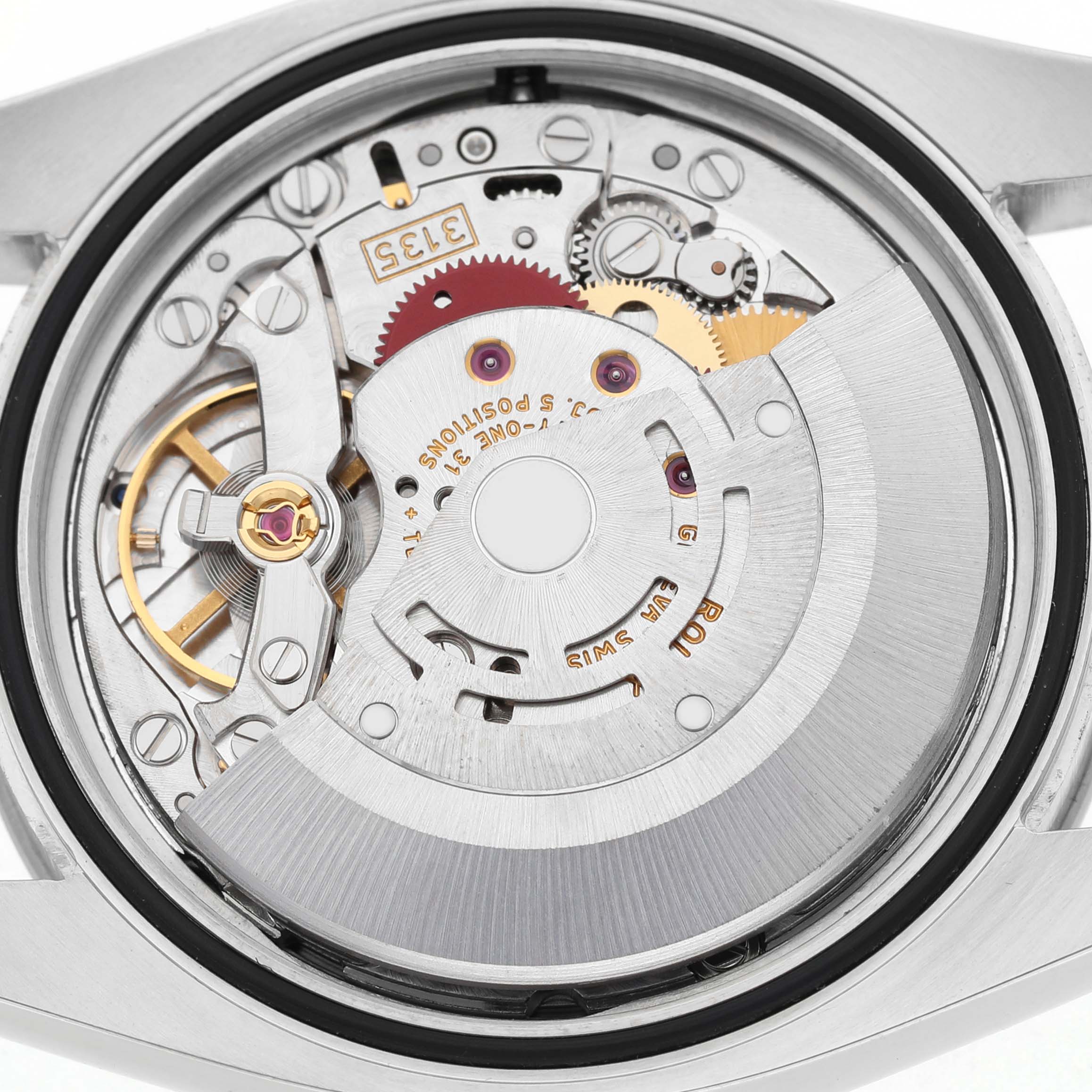 The image shows the movement of a Rolex Turn-o-Graph 116264 Men's Stainless Steel Black Dial watch from the back, revealing gears and mechanisms.