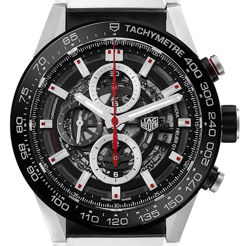 The Tag Heuer Carrera watch is shown from a front angle, highlighting its tachymeter bezel and intricate dial.