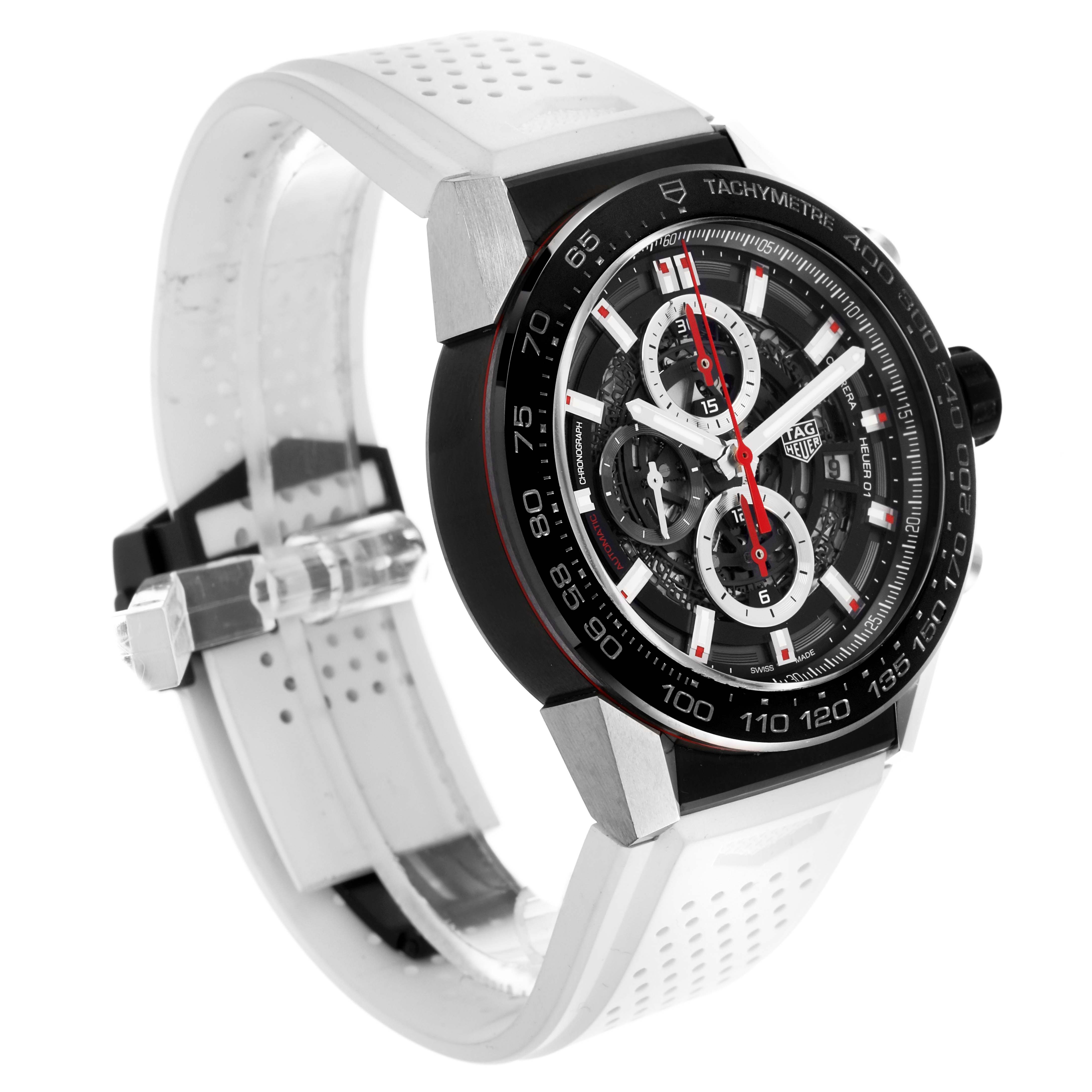 The Tag Heuer Carrera CAR2A1Z.FT6051 Men's Stainless Steel Transparent Dial CAR2A1Z.FT6051 Men's Stainless Steel Transparent Dial watch is shown at a three-quarters angle, highlighting its dial, bezel, and white strap with a tachymeter scale.