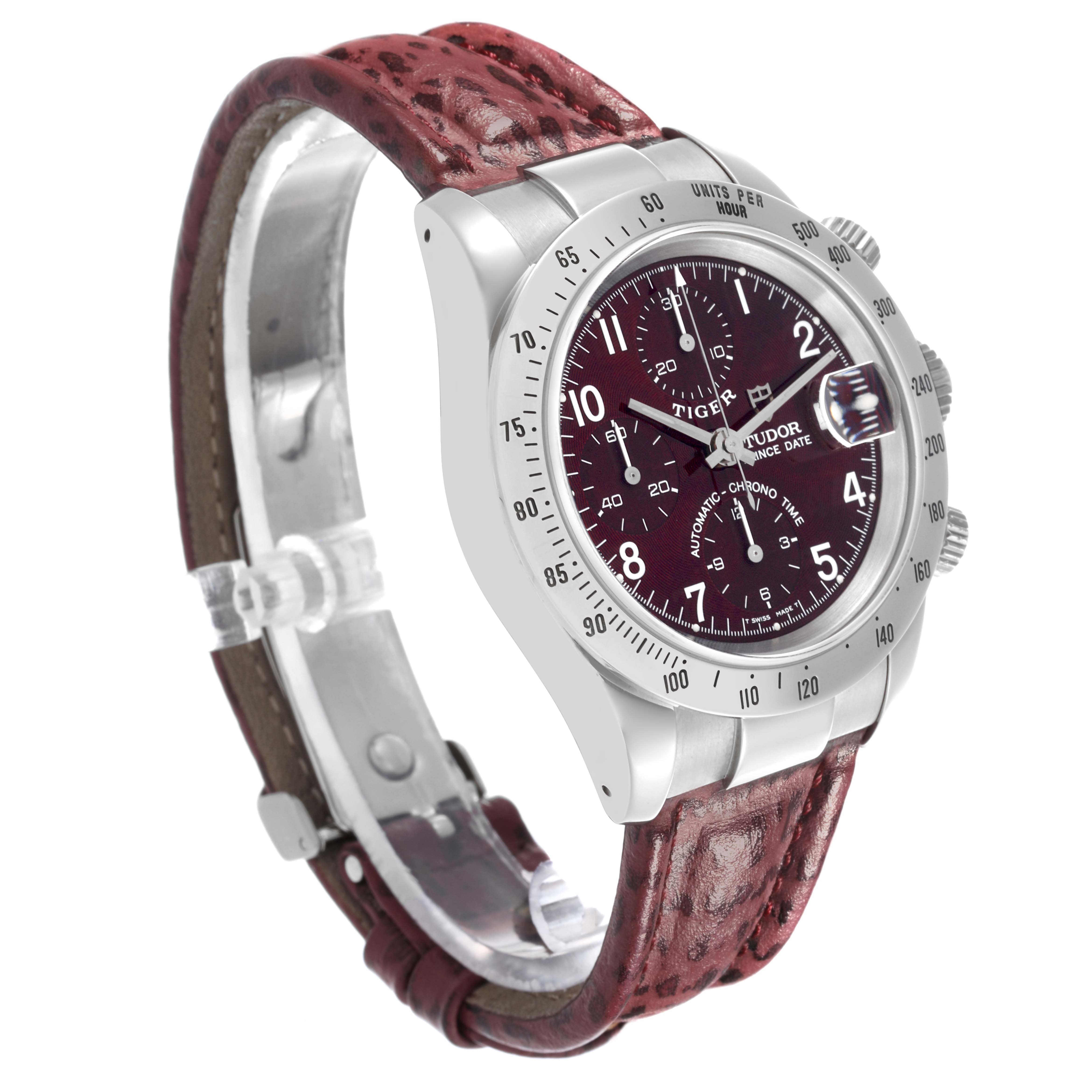 The Tudor Tiger 79280P Men's Stainless Steel Red Dial 79280P Men's Stainless Steel Red Dial watch is shown at a slight angle, highlighting the dial, bezel, case, and the textured leather strap.
