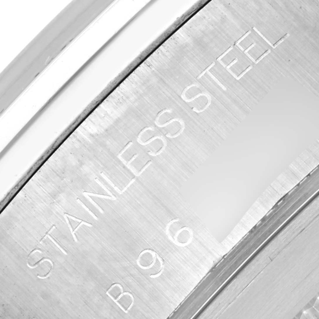 The image shows a close-up of the casing back of a Tudor Tiger 79280P Men's Stainless Steel Red Dial 79280P Men's Stainless Steel Red Dial model watch with "STAINLESS STEEL" engraved.