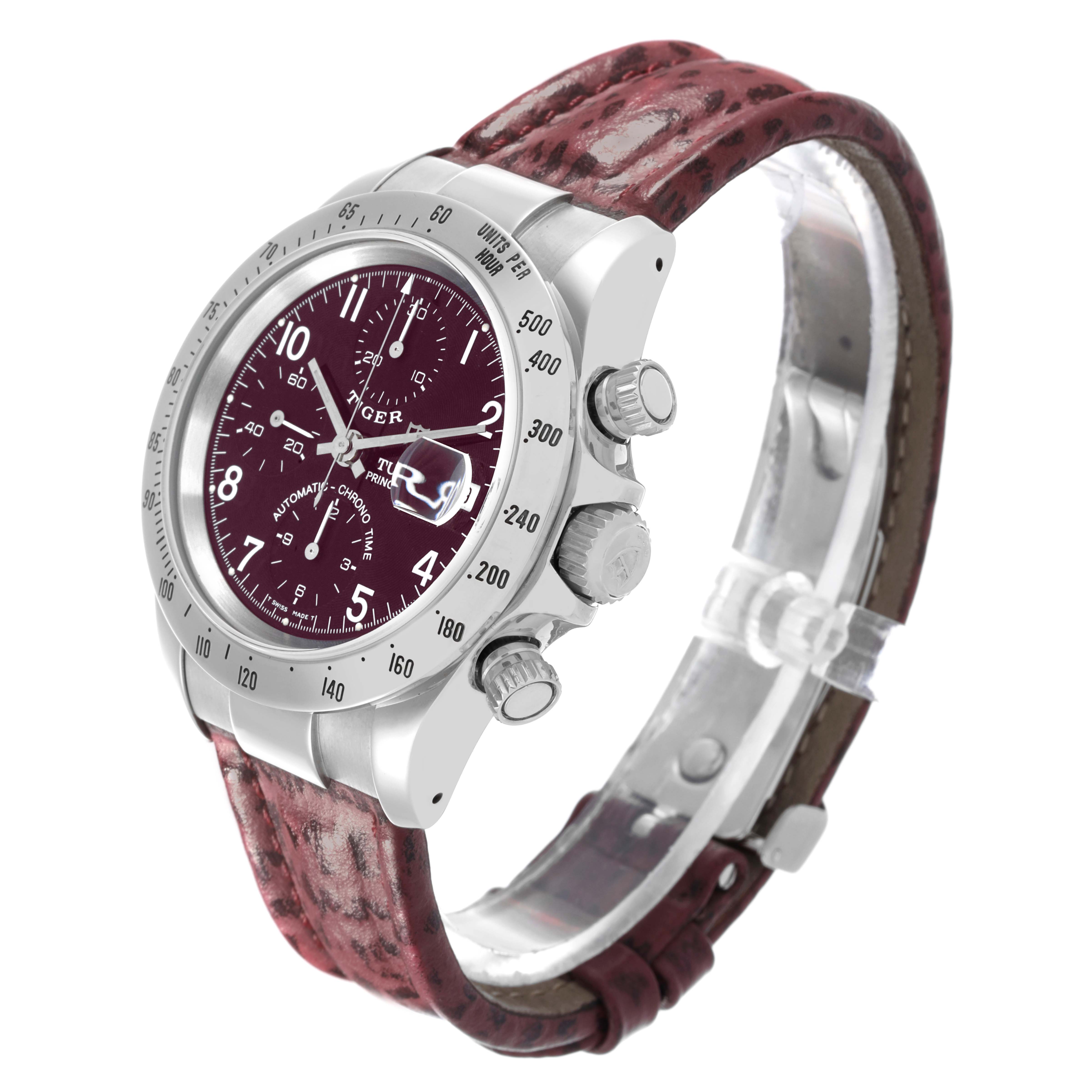 The Tudor Tiger 79280P Men's Stainless Steel Red Dial 79280P Men's Stainless Steel Red Dial watch is shown from an angled side view, highlighting the dial, bezel, crown, pushers, and leather strap.