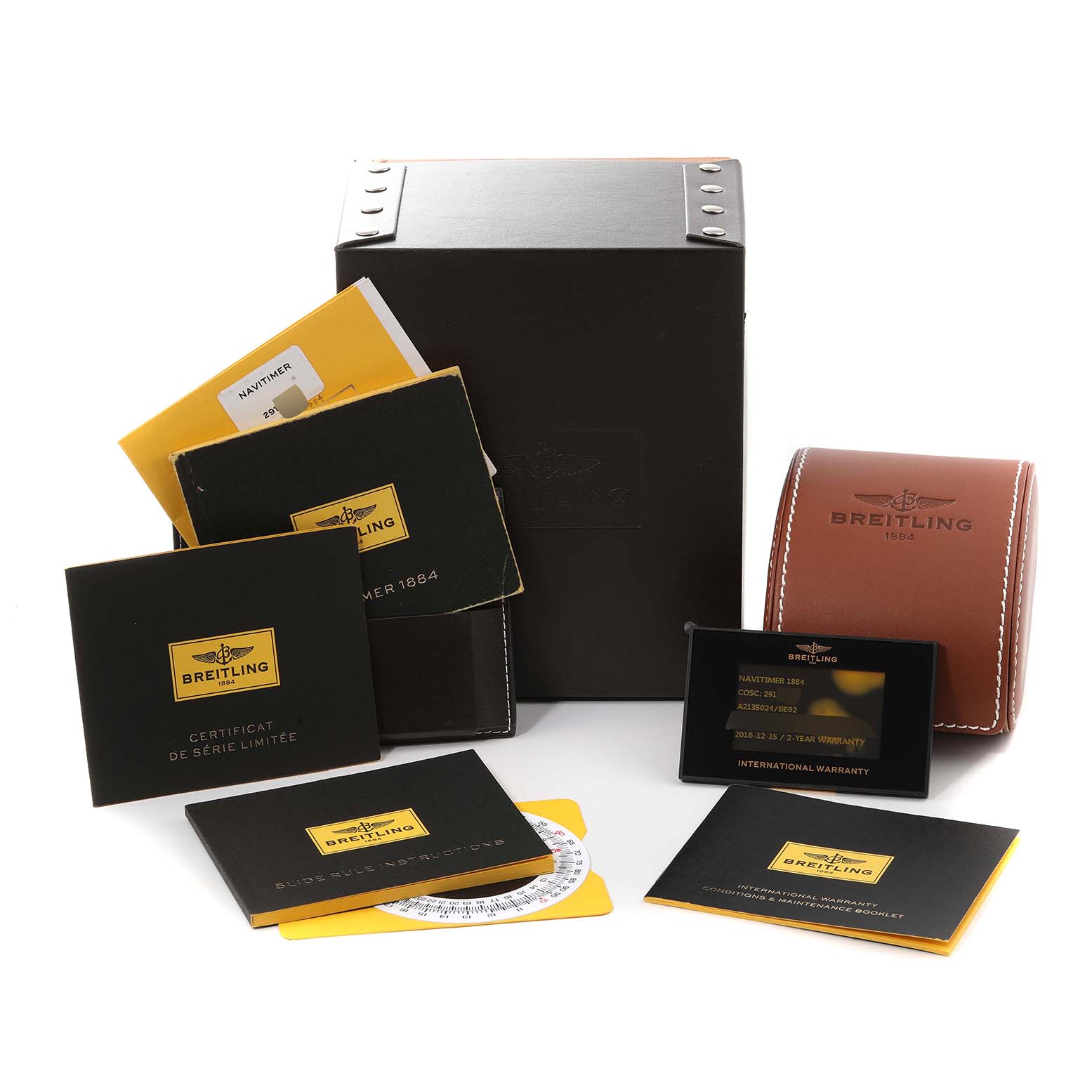 The image shows a Breitling Limited Series watch packaging including the box, warranty cards, and manuals.
