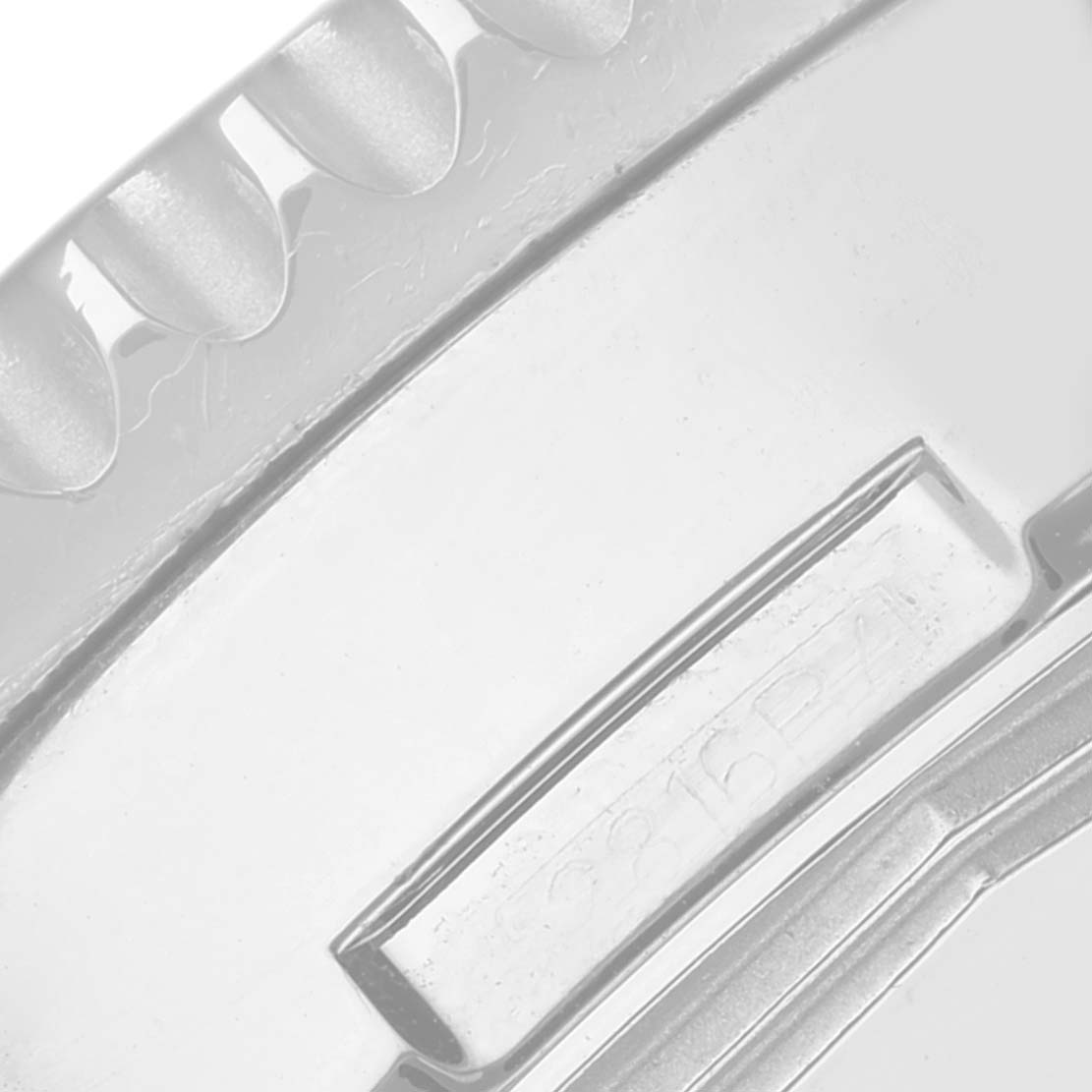 The image shows a close-up of the bezel teeth and crown guard of a Breitling Limited Series watch.