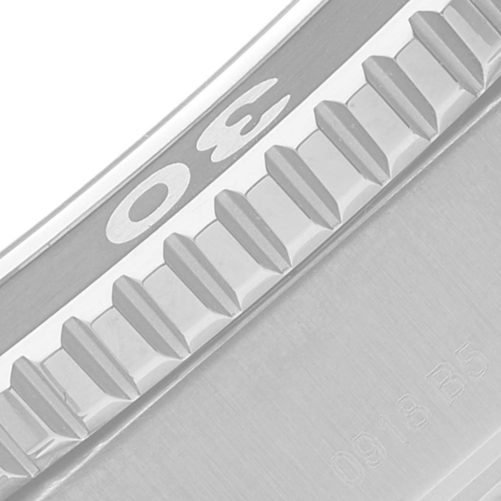 The image shows a close-up of the bezel and edge of a Breitling Superocean A17392 Men's Stainless Steel Black Dial A17392 Men's Stainless Steel Black Dial watch, highlighting the numerals and serrated grip design.