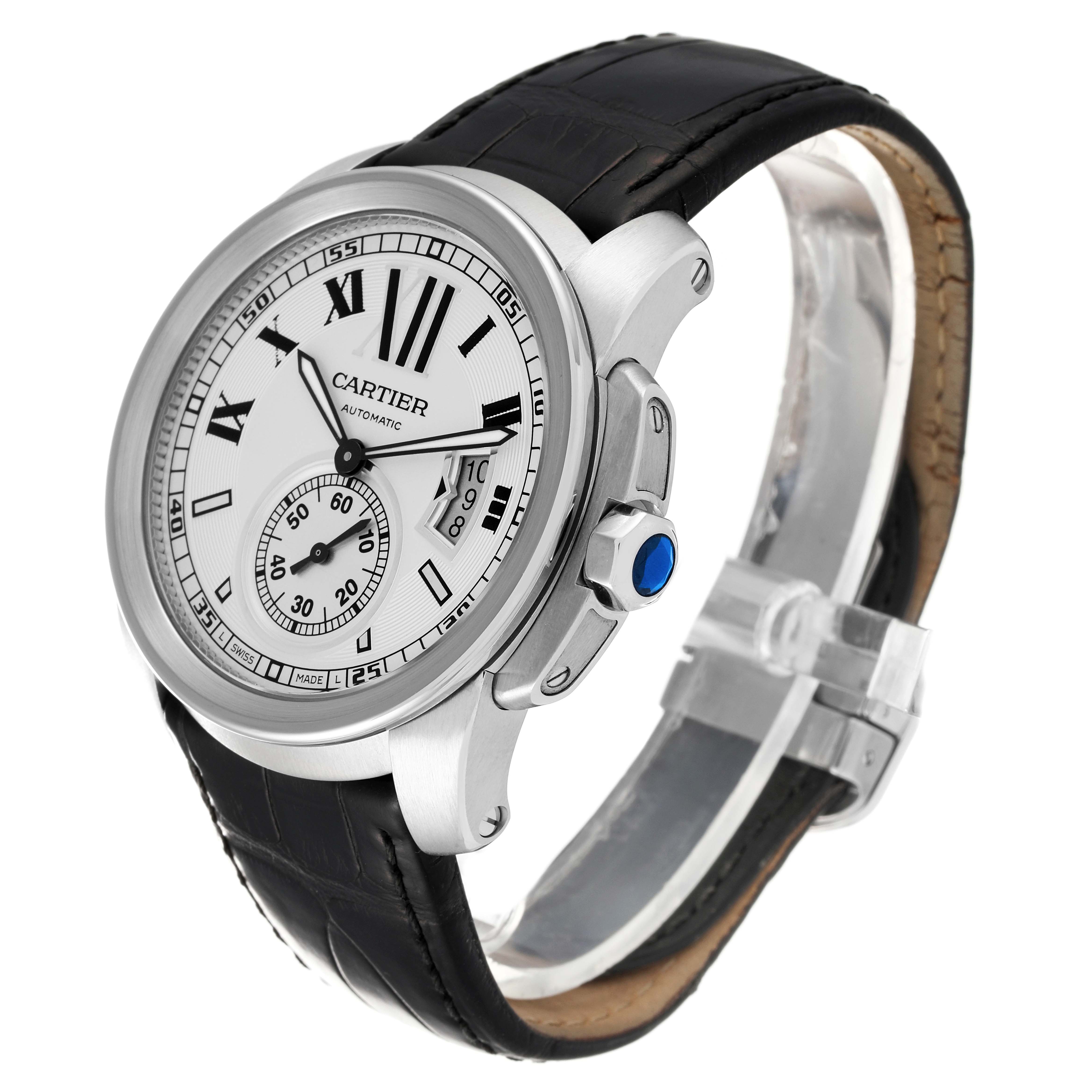 The Calibre de Cartier watch by Cartier is shown in a three-quarter angle, highlighting its face, crown, and leather strap.