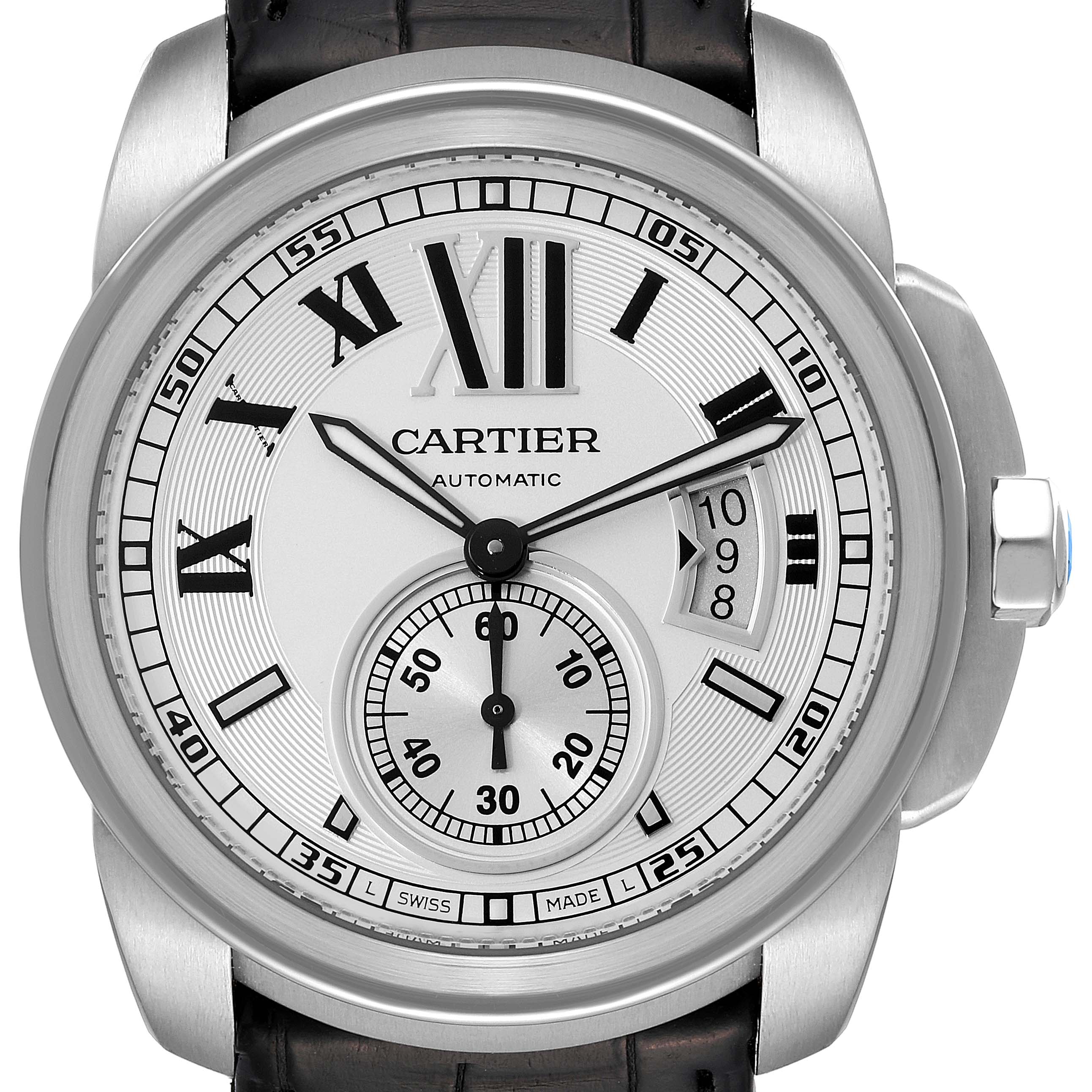 This is a close-up view of the Calibre de Cartier watch by Cartier, showing the dial, hands, date window, and a portion of the strap and case.