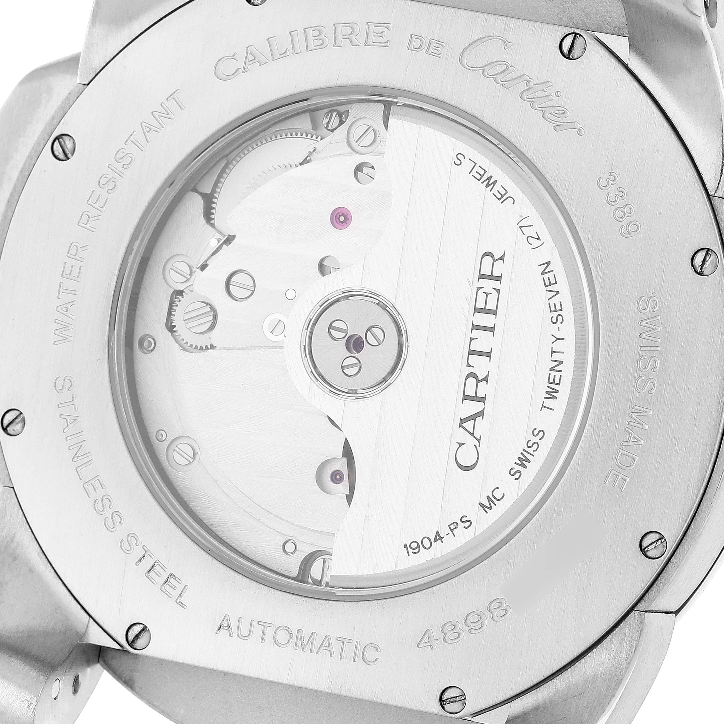 The image shows the back of the Calibre de Cartier watch by Cartier, highlighting the automatic movement and stainless steel case.