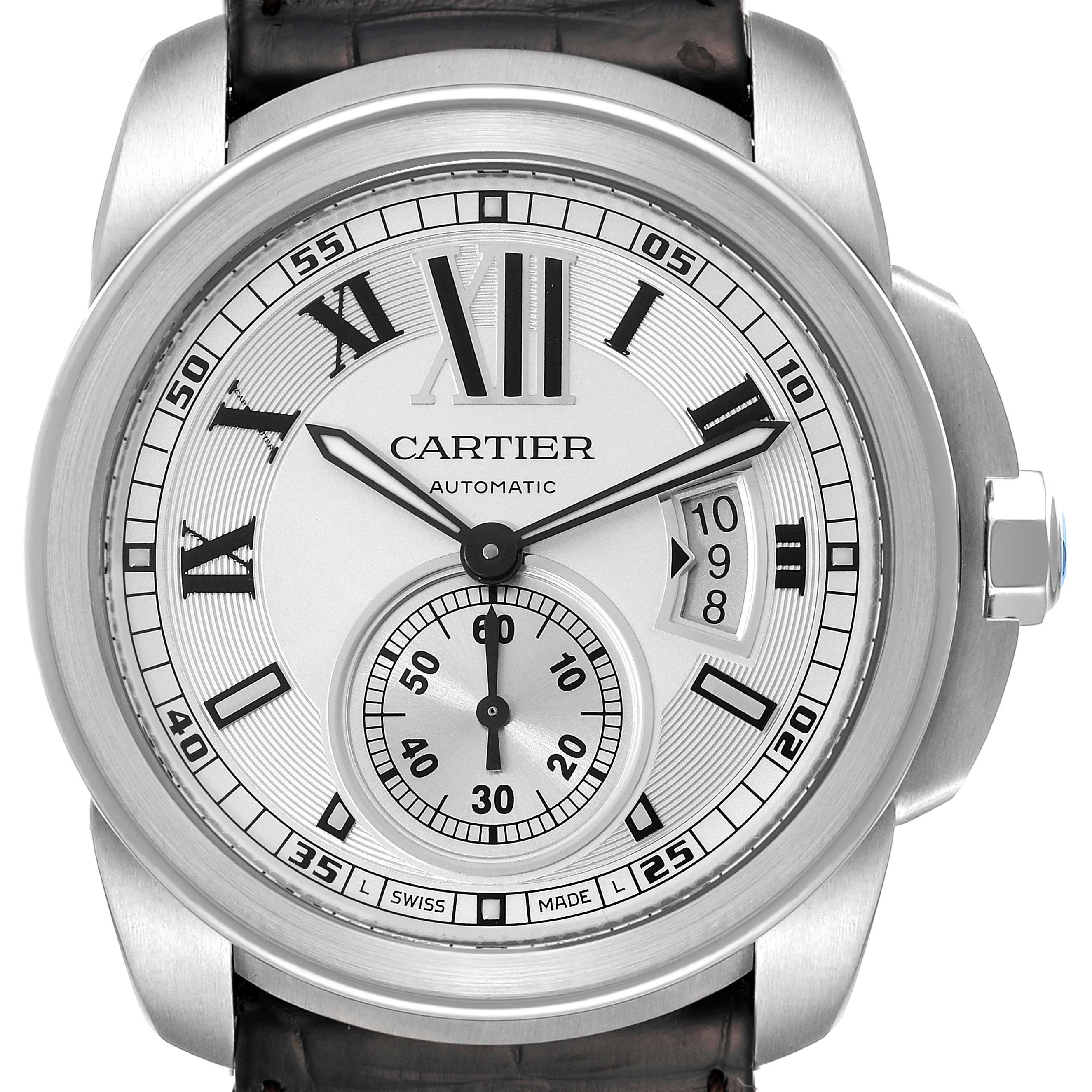The image shows a frontal view of a Calibre de Cartier watch by Cartier, displaying the dial, hands, date, and subdial.