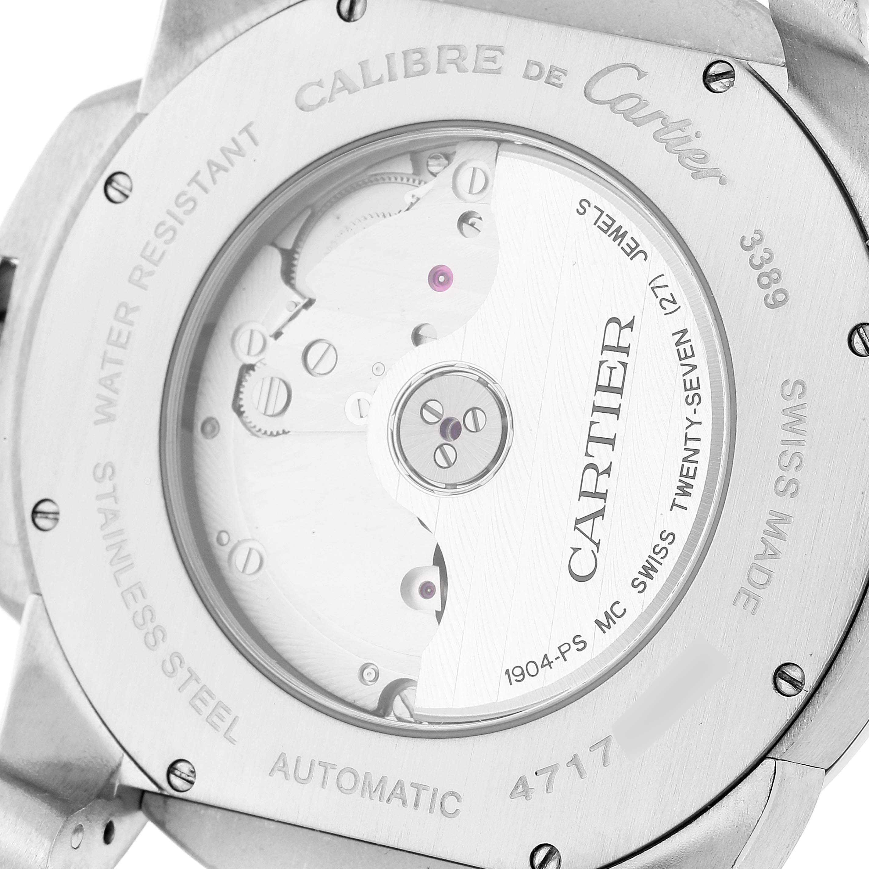 This image shows the back view of the Calibre de Cartier watch by Cartier, highlighting its automatic movement and stainless steel casing.