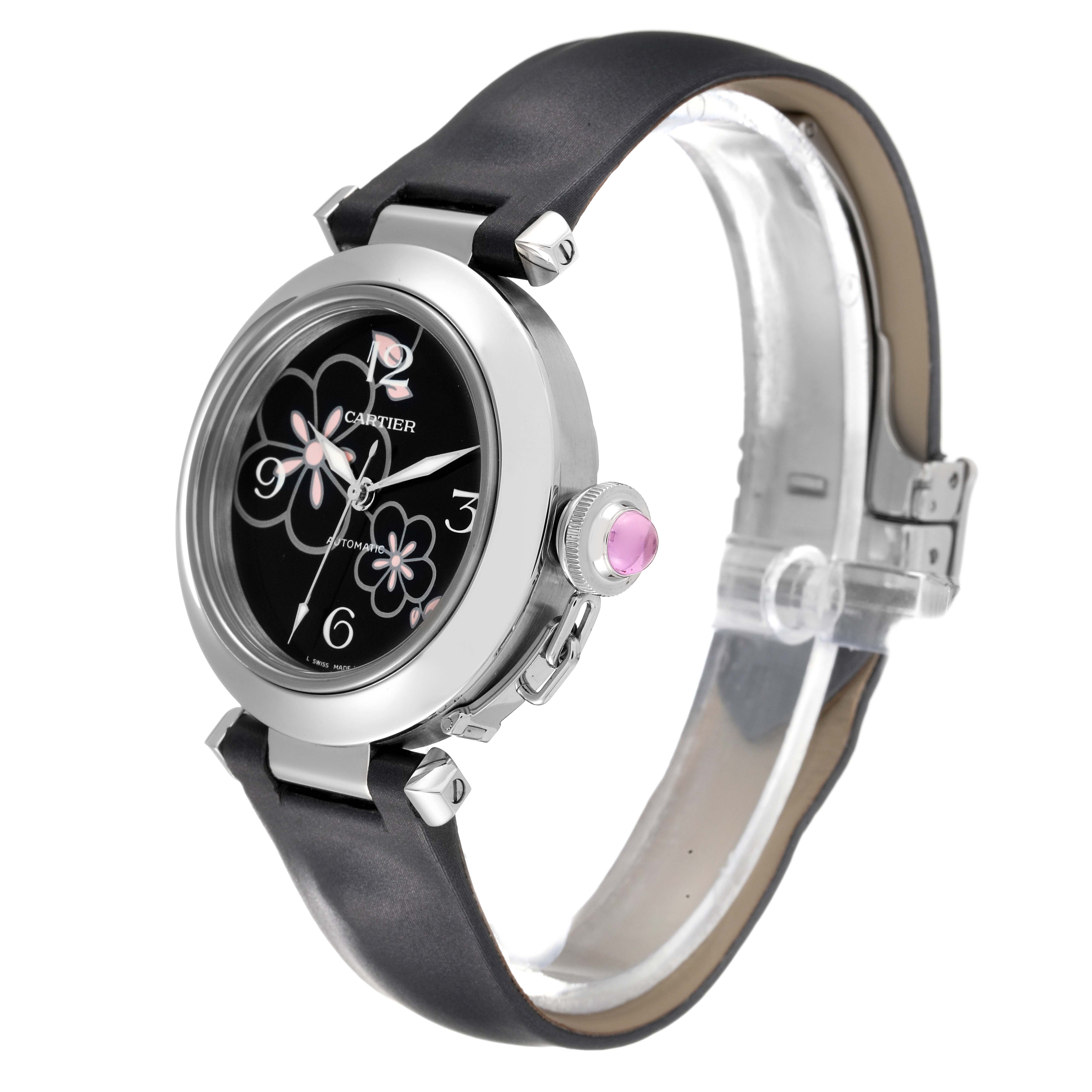 This image shows a side view of the Cartier Pasha W3109699 Women's Stainless Steel Black Dial W3109699 Women's Stainless Steel Black Dial watch, highlighting its face, strap, and the crown with a pink jewel.