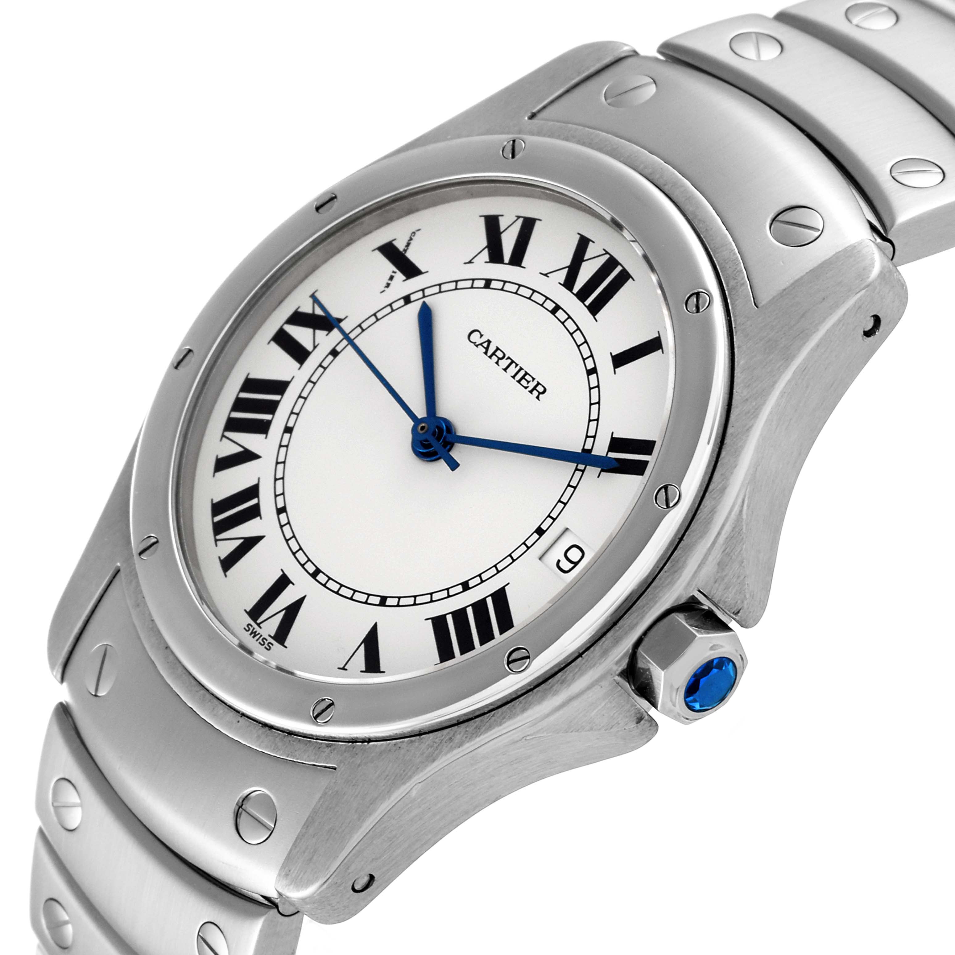 This image shows the face and part of the bracelet of a Cartier Santos 1920 Men's Stainless Steel White Dial 1920 Men's Stainless Steel White Dial watch at a 3/4 angle, highlighting the crown with a blue gem.