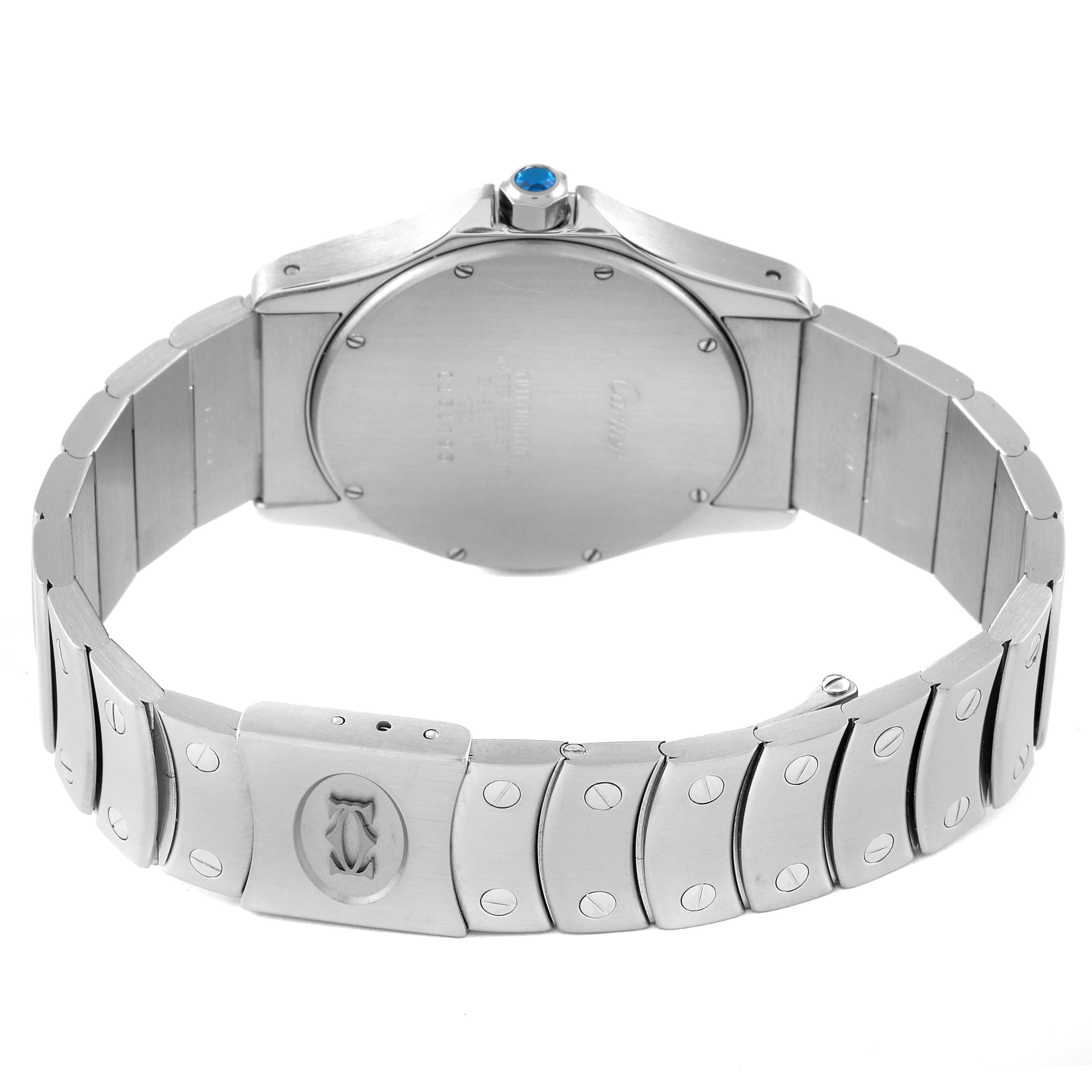 The image shows the back case and bracelet of a Santos model watch by Cartier, with a focus on the clasp and crown.