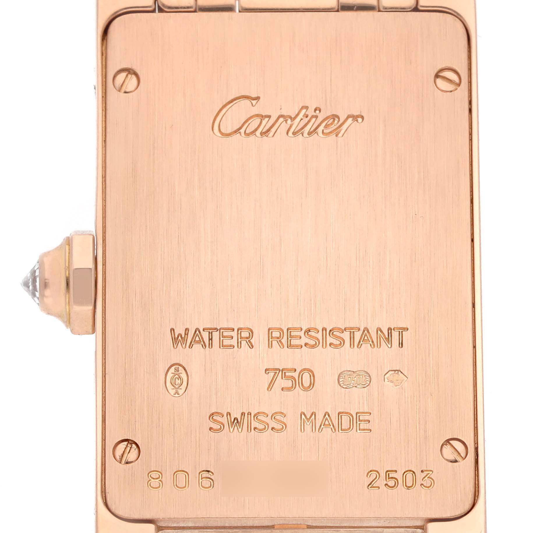 The image shows the back case of the Cartier Tank Americaine WB7079M5 Women's Rose Gold Silver Dial WB7079M5 Women's Rose Gold Silver Dial watch, displaying engraved details and screws.