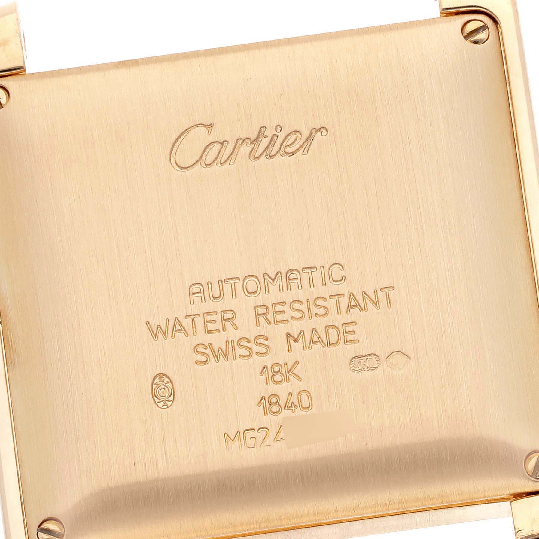 This image shows the case back of a Cartier Tank Francaise W5000156 Men
s Yellow Gold Silver Dial W5000156 Men
s Yellow Gold Silver Dial watch, highlighting its engravings and gold finish.