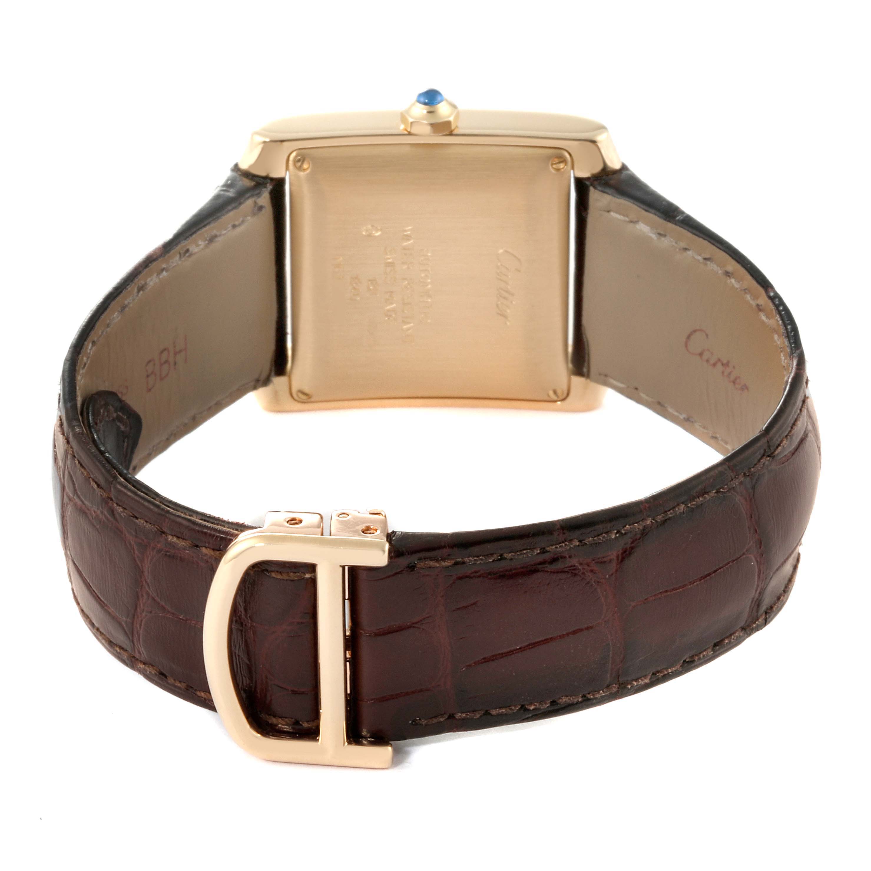 The image shows the back view of a Cartier Tank Francaise W5000156 Men
s Yellow Gold Silver Dial W5000156 Men
s Yellow Gold Silver Dial watch, highlighting the case back and brown leather strap with a clasp.