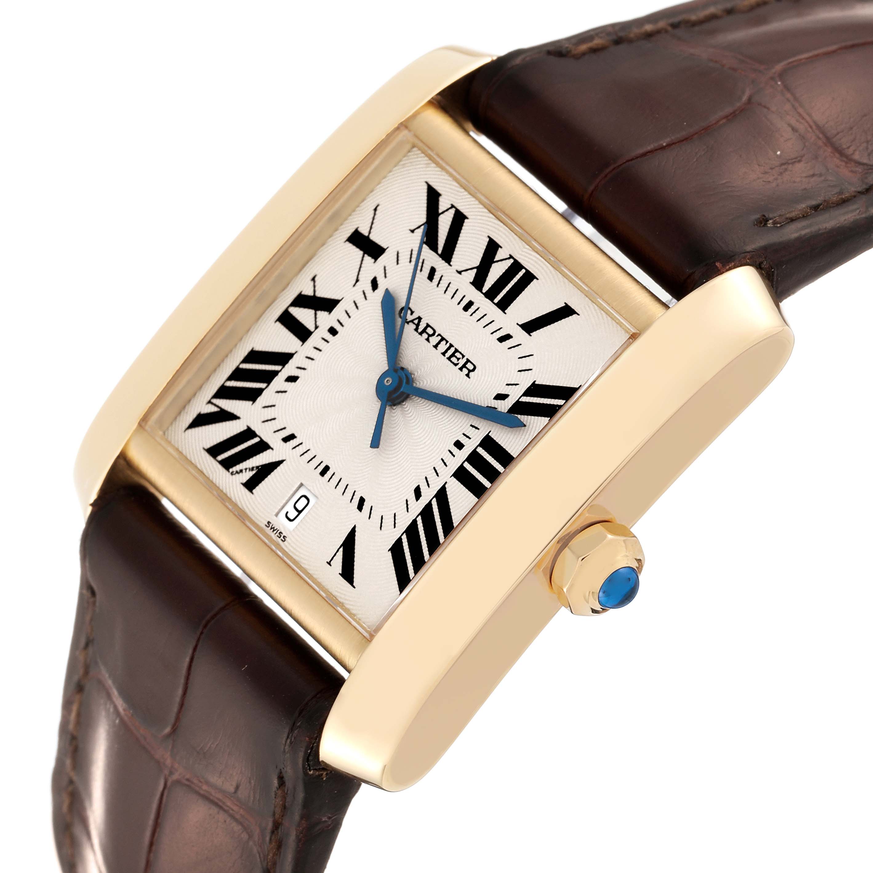This image shows a Cartier Tank Francaise W5000156 Men
s Yellow Gold Silver Dial W5000156 Men
s Yellow Gold Silver Dial watch at an angled view, highlighting its face, brown leather strap, and gold casing with a sapphire cabochon crown.