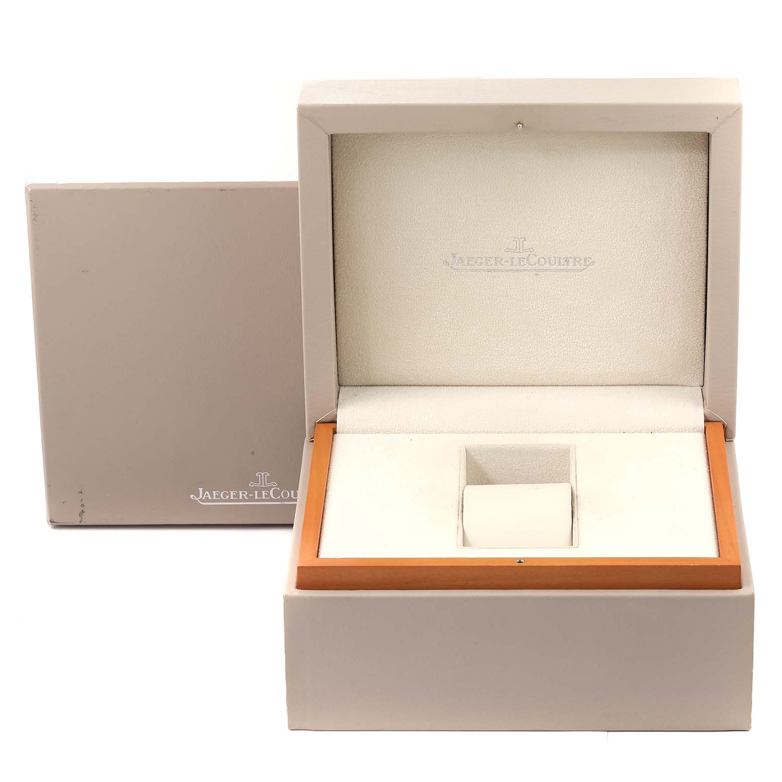 The image shows an opened Jaeger-LeCoultre Reverso watch box displaying its interior compartments and external packaging.