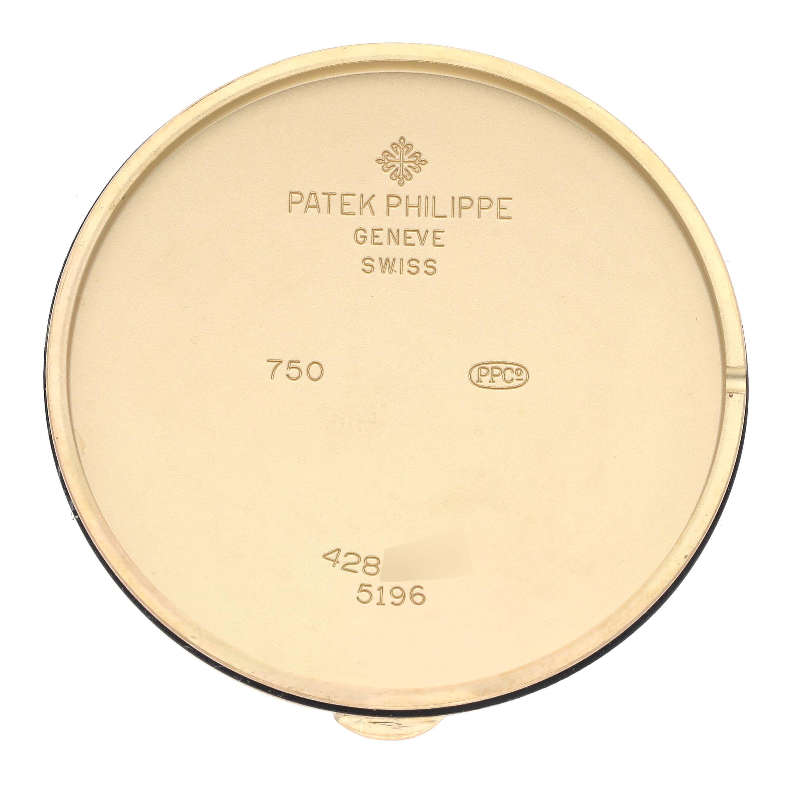 This image shows the inside case back of a Patek Philippe Calatrava 5196J Men's Yellow Gold Silver Dial 5196J Men's Yellow Gold Silver Dial watch, featuring brand markings and reference numbers.