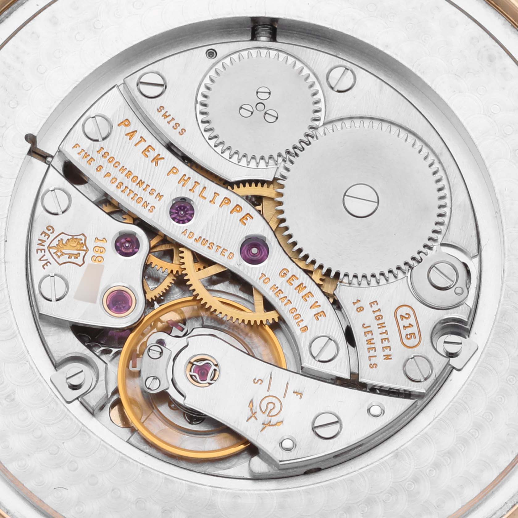 This image shows the intricate movement mechanism of the Patek Philippe Calatrava 5196J Men's Yellow Gold Silver Dial 5196J Men's Yellow Gold Silver Dial watch from a top-down angle.