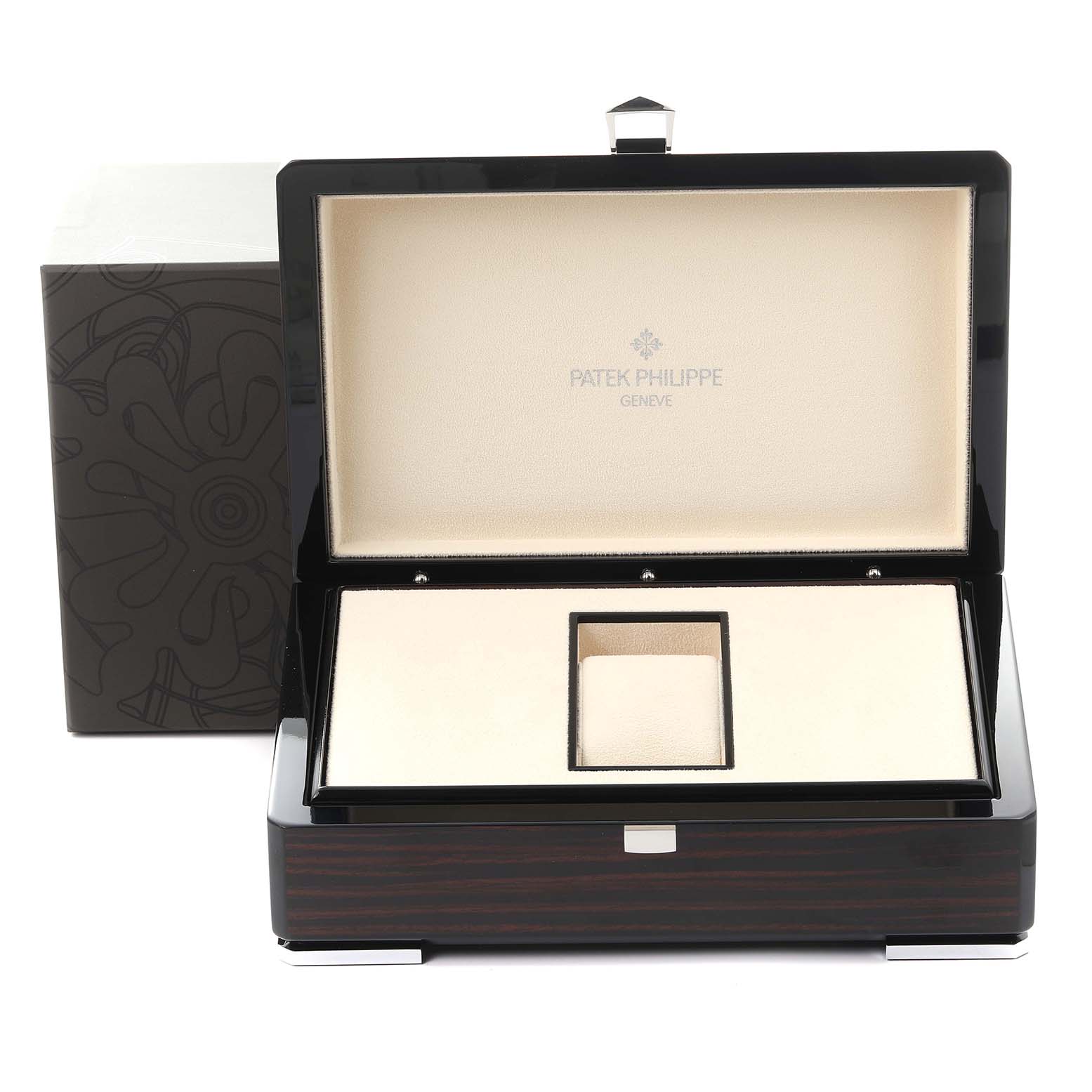 The image shows an open Patek Philippe Twenty-4 4910/20G-011 Women's White Gold Black Dial 4910/20G-011 Women's White Gold Black Dial watch box, displaying its internal compartments and logo.
