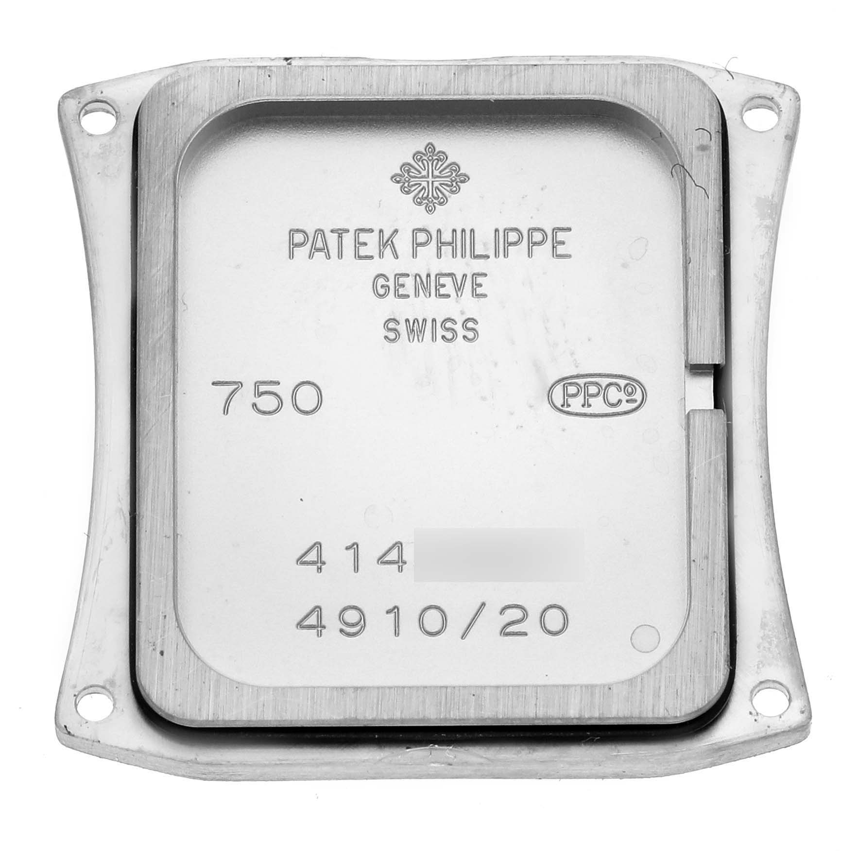 The image shows the back case of a Patek Philippe Twenty-4 4910/20G-011 Women's White Gold Black Dial 4910/20G-011 Women's White Gold Black Dial watch, displaying engravings and the brand name.