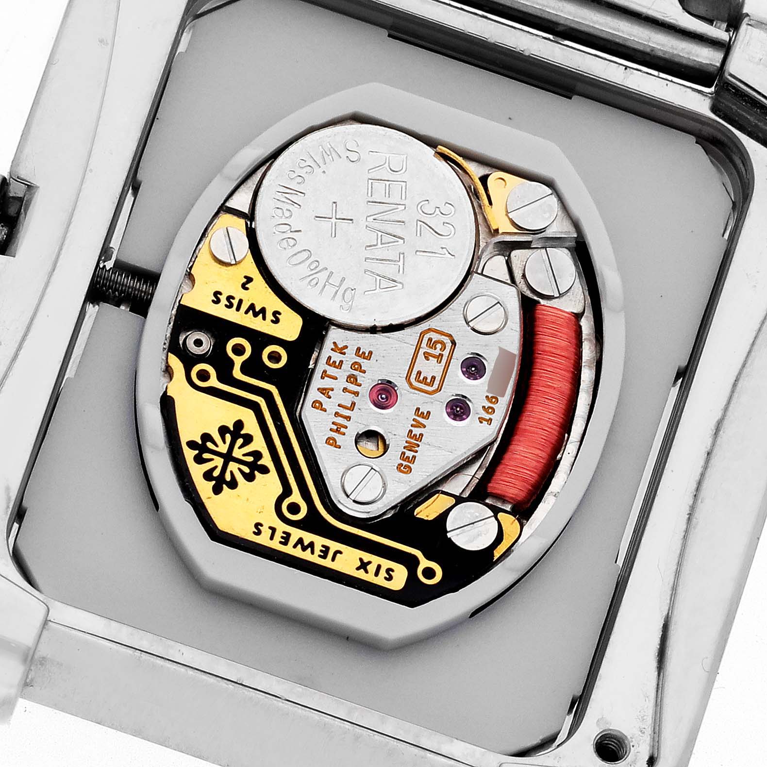 The image shows the movement and internal mechanics of the Patek Philippe Twenty-4 4910/20G-011 Women's White Gold Black Dial 4910/20G-011 Women's White Gold Black Dial watch.